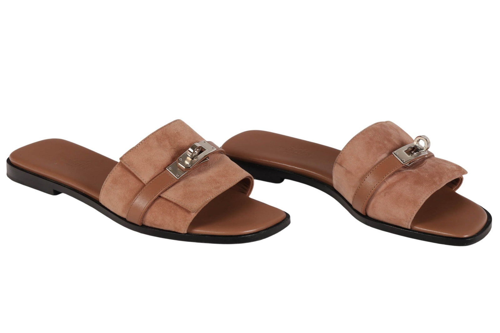 Hermes Giulia Calfskin Suede Sandals with Box sz37: Pair of Hermes Giulia slide sandals featuring beige calfskin suede uppers with signature palladium-plated Kelly-inspired buckle hardware. The sandals feature open square toes, smooth leather insoles,