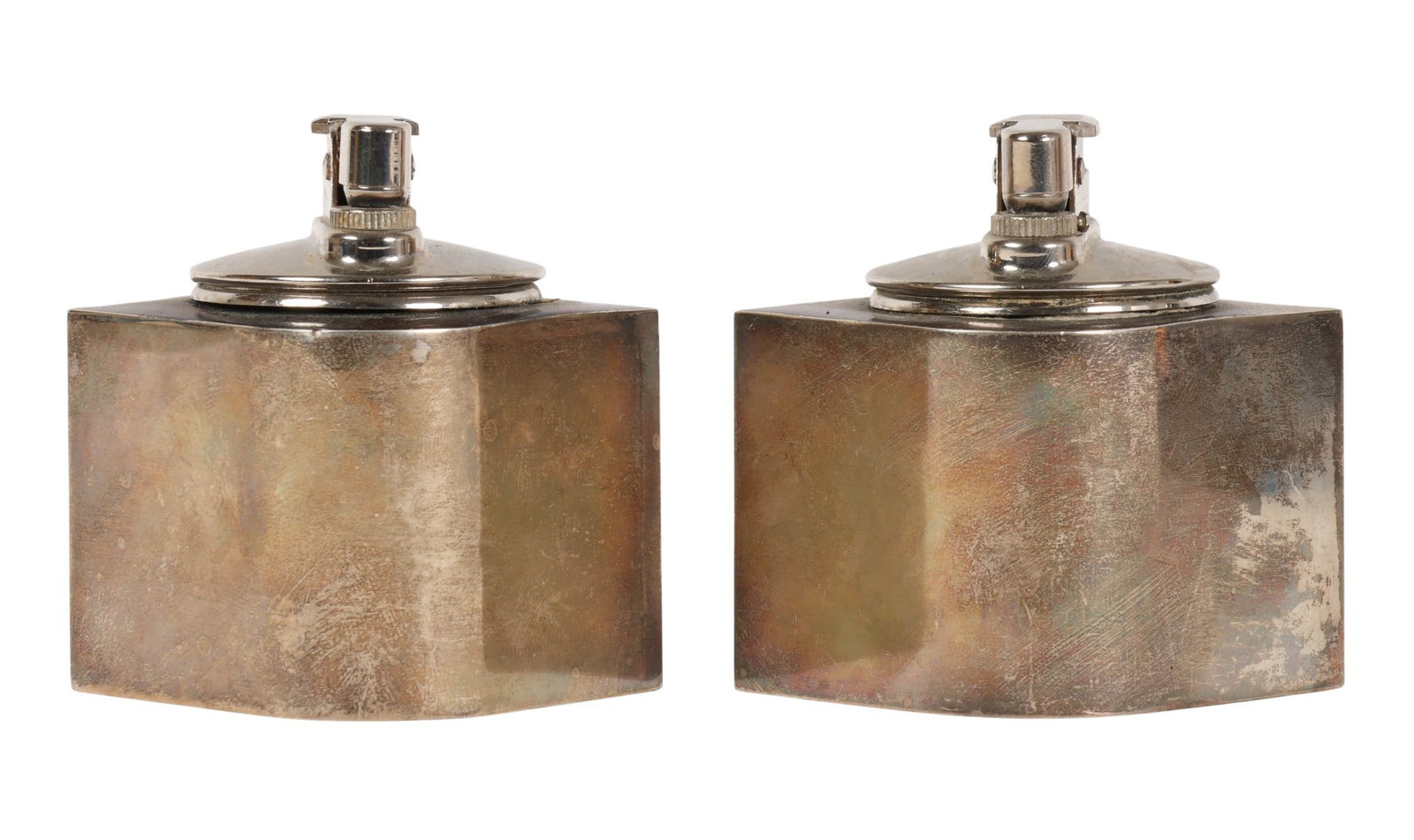 Cartier Sterling Silver Modern Table Lighters LOT: Pair of Cartier weighted sterling silver table lighters featuring a sleek Mid-Century Modern square form with polished chrome-tone lighter mechanisms. Each lighter is marked "Cartier Sterling Weighted