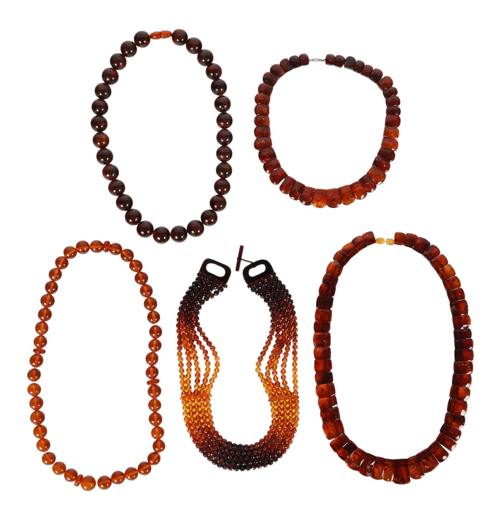 Amber Beaded Necklaces 5pc ESTATE COLLECTION LOT: Estate grouping of five necklaces in assorted styles featuring graduated spherical beads, faceted strands, and irregular panel form segments. One example displays cascading tiers with tonal variation 