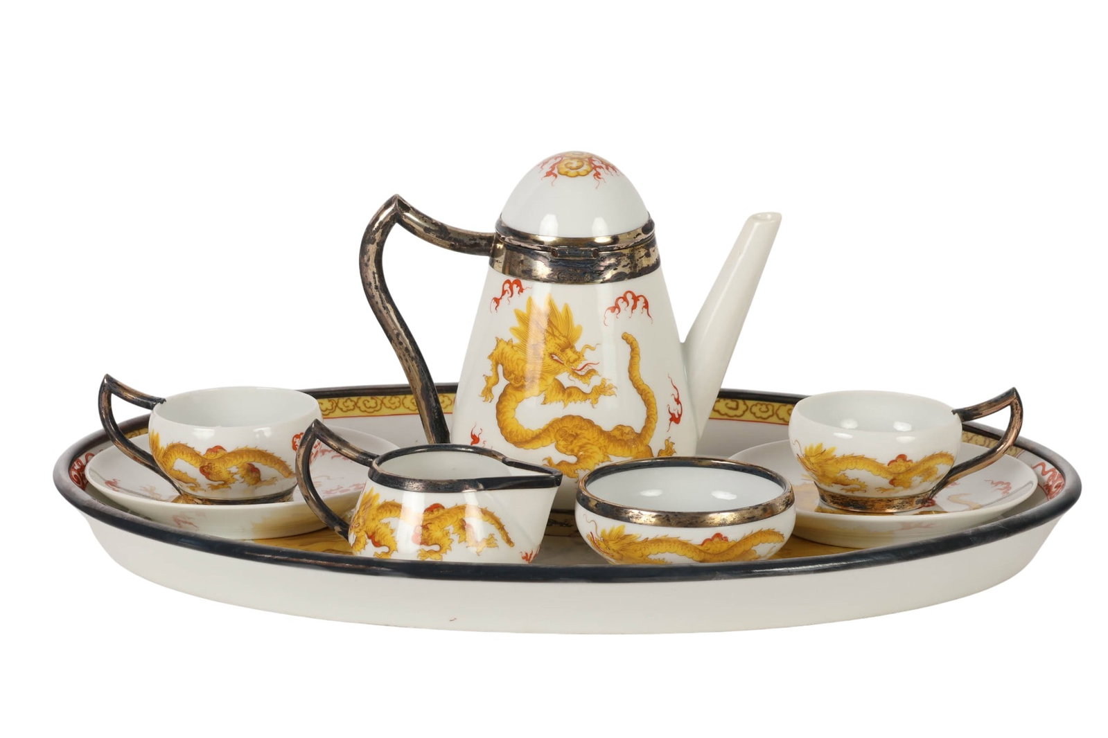 Meissen Dragon 800 Silver Porcelain Demitasse SET: Meissen German porcelain demitasse set in the yellow Dragon pattern with 800 silver mounts, comprising an oval tray, covered teapot, open sugar bowl, creamer, and two cups with saucers. Each piece dec