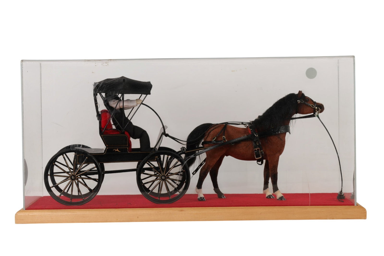 Mel Riegsecker 20/21C Amish Horse and Buggy Model: Mel Riegsecker American 20th 21st century of Shipshewana Indiana, handcrafted Amish horse and buggy model displayed within a shadow box case. The scene features a brown horse with harness and reins pu