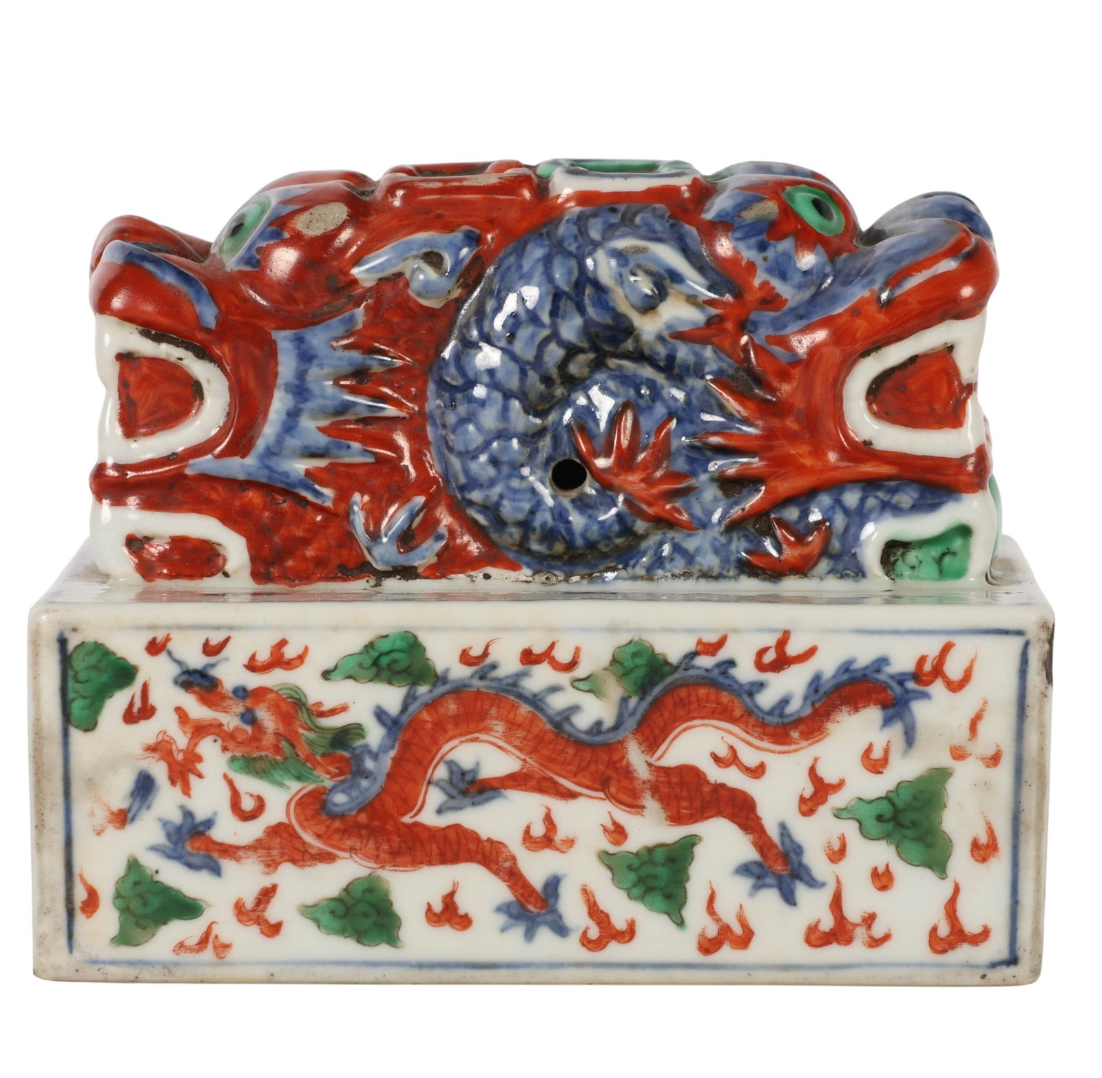 Chinese Porcelain Dragon Form Scholars Seal Chop: Chinese porcelain scholars figural seal chop-style decorative desk object featuring a recumbent dragon or guardian beast rendered in vibrant iron red, cobalt blue, green, and white glazes. The dragon 
