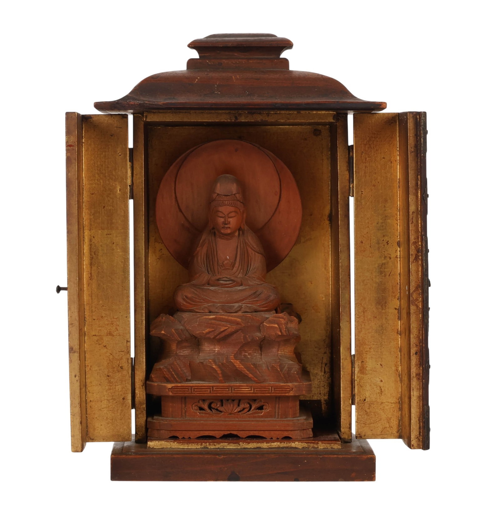 Japanese 19C. Wooden Traveling Zushi Buddha Shrine: Antique Japanese carved wooden traveling shrine (zushi) featuring a seated Buddha figure housed within a portable cabinet form with double opening doors. The interior retains gilt decorated panels fra