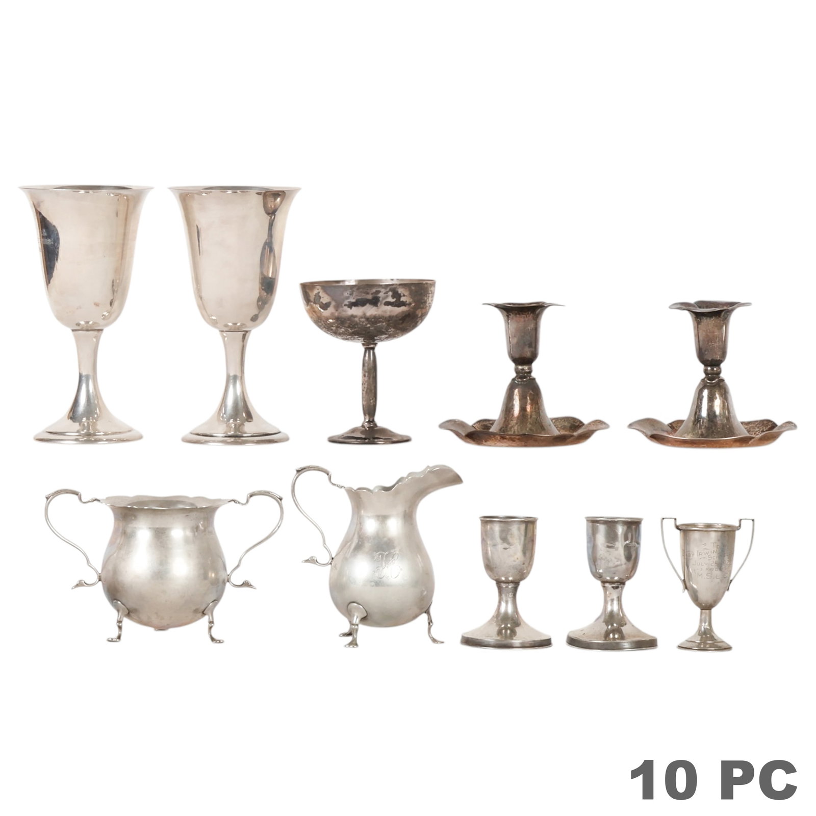 Sterling Silver Candleholders Goblet Cup 10pc LOT: Assorted ten-piece sterling silver hollowware group including a matching sterling silver creamer and sugar bowl with ornate feet and handles, two goblets engraved "N. Meyer 1965," a stemmed champagne 