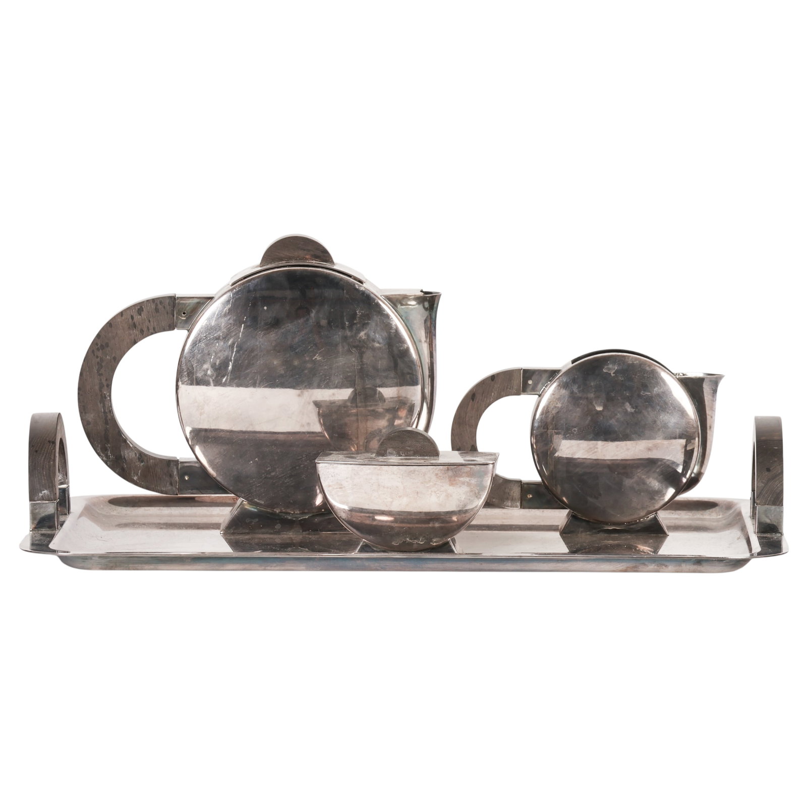 Christofle French Art Deco Silverplate 4pc Tea Set: Christofle France four-piece Art Deco silver-plated tea and coffee service designed by Christian Fjerdingstad, featuring a Machine Age geometric modernist design. The set comprises a covered coffee po