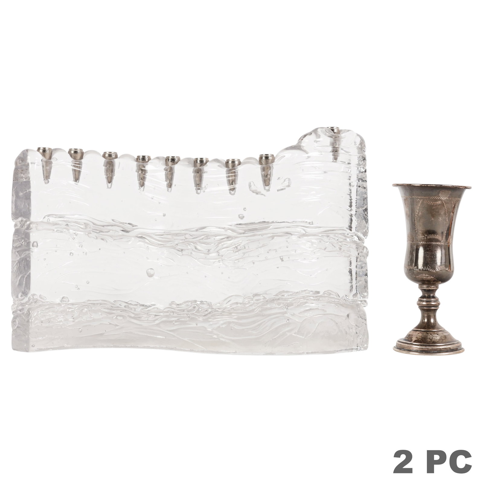 Sterling Cup and Art Glass "Wave" Menorah 2pc OT: Joel and Candace Bless hand-blown glass menorah and silverplate Kiddush cup. The contemporary clear glass menorah features the artists' Wavy Iceberg design with textured wave-like decoration and fitte
