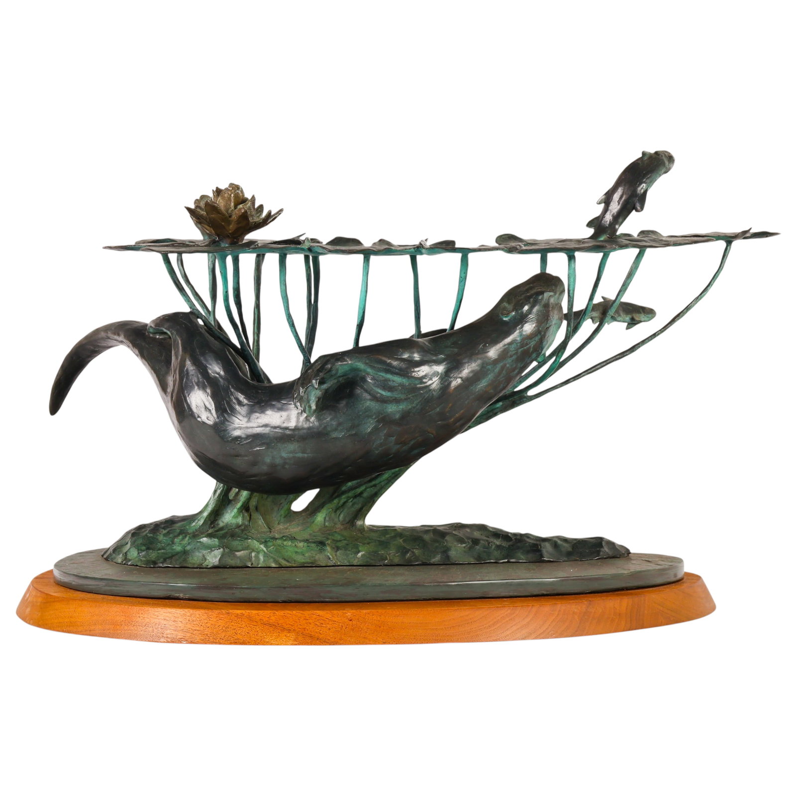 Hollis Williford 1940-2007 Bronze Otter Sculpture: Hollis Williford (American, 1940-2007), bronze sculpture depicting swimming otters chasing fish beneath an elaborate grouping of lily pads and blooming lotus flowers. The composition features finely t