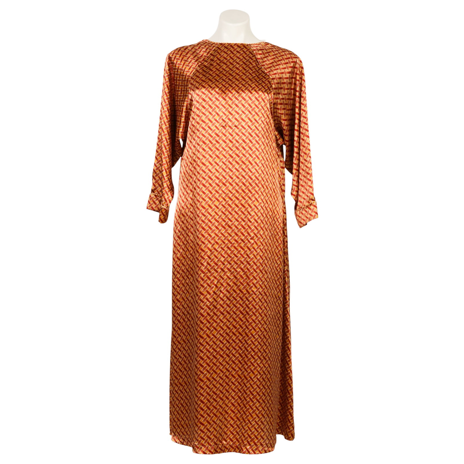 Dior Silk Caftan Style Long Nightgown Lounge Dress: Christian Dior vintage luxury designer silk printed lounge dress or caftan featuring an allover geometric basketweave-style pattern in shades of gold, mustard, rust, and brown. The loose-fitting garme
