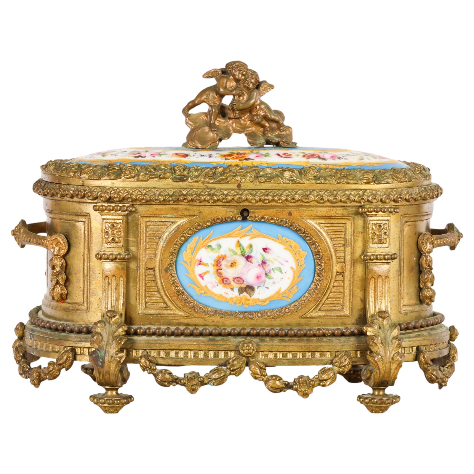Antique French Limoges Porcelain Ormolu Casket Box: Antique French ormolu jewelry casket featuring hand-painted Limoges-style porcelain floral panels with cobalt blue borders, hinged lid, figural cherub finial, pierced gallery, and blue fabric-lined in