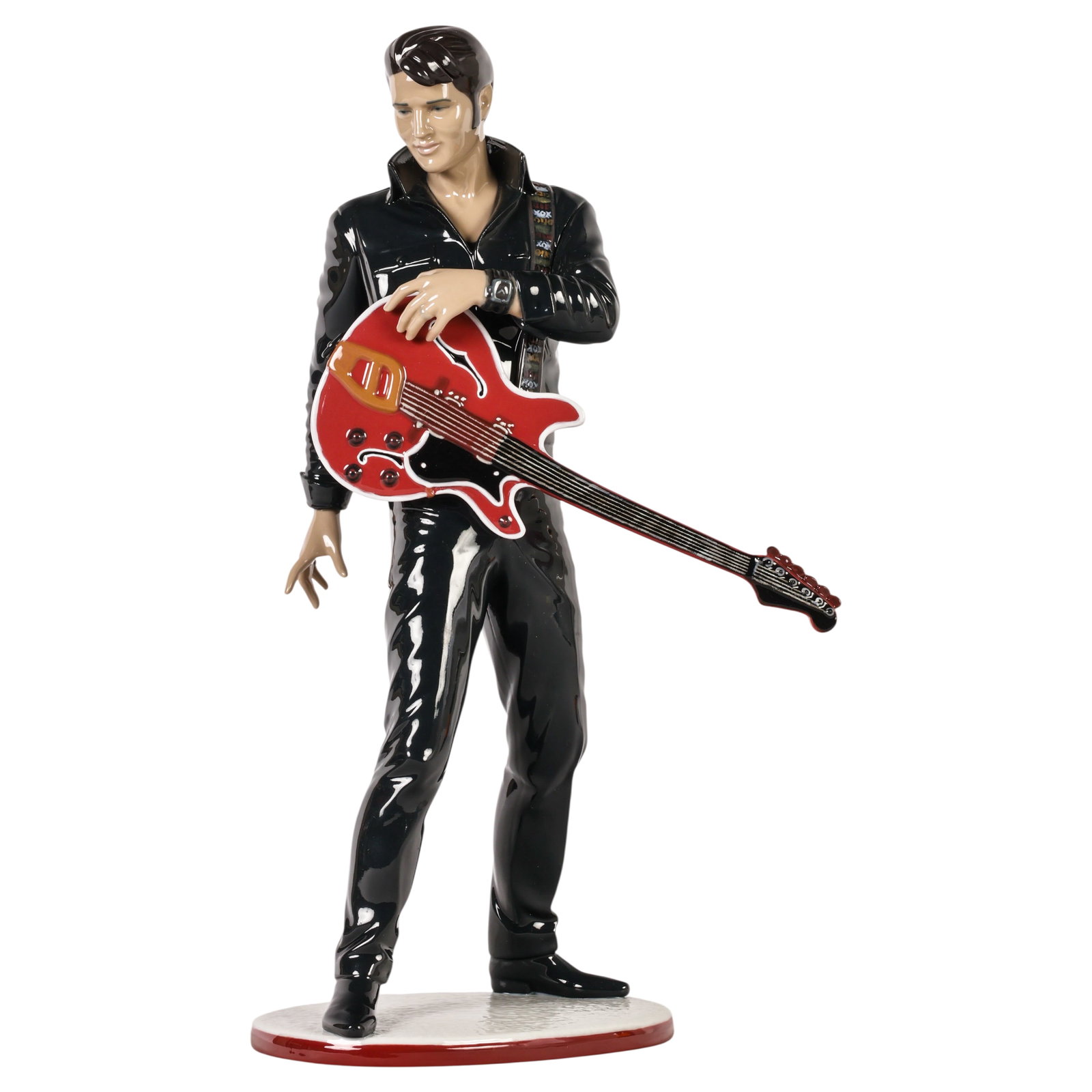 Lladro Elvis Presley #01008469 Porcelain Sculpture: Lladro Elvis Presley porcelain figurine, model #01008469, sculpted by Marco Antonio Nogueron and produced in Spain. This glazed porcelain sculpture depicts Elvis Presley inspired by his iconic 1968 NB