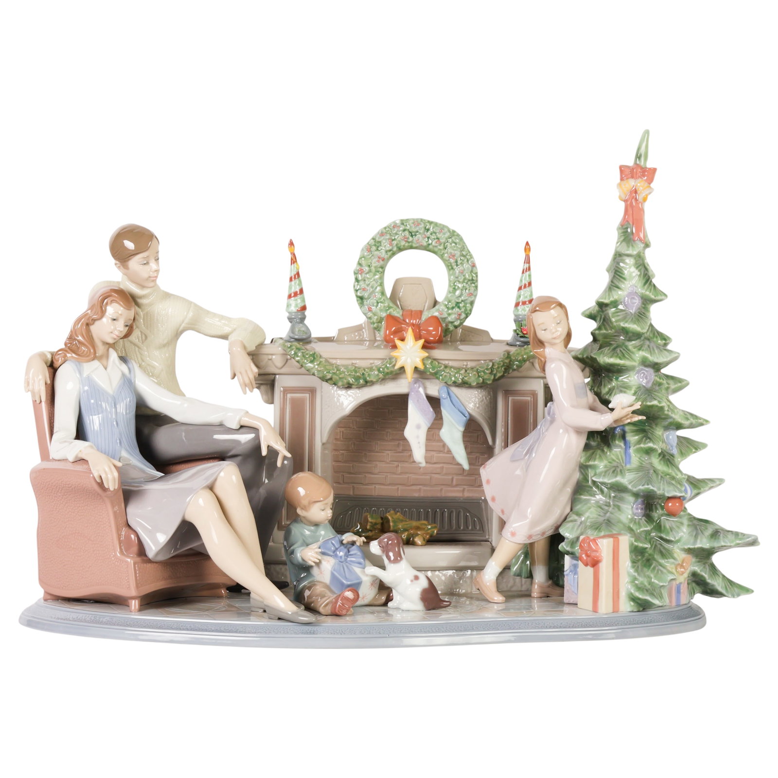 Lladro A Family Christmas Figural Group Sculpture: Lladro A Family Christmas limited edition porcelain figural group, model #01008260, designed by Francisco Polope and issued in 2006. This finely detailed glazed Spanish porcelain composition depicts a