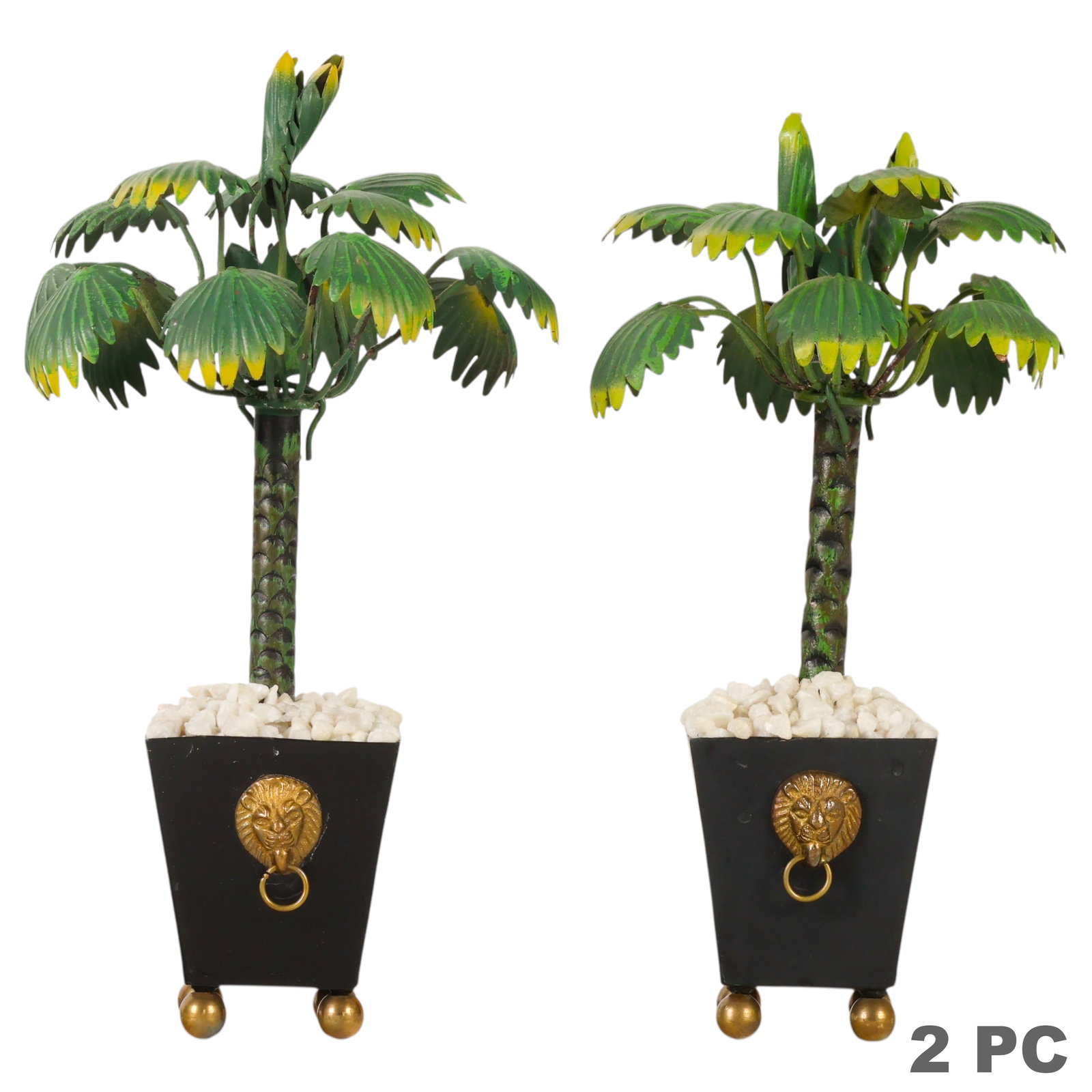 Hollywood Regency Pair of Palm Tree Tole Topiaries: Hollywood Regency pair of tole palm tree topiaries. Metal palm trees mounted in black painted urns with lion head handles on each side, raised on brass ball feet and filled with white rock. Each tree 