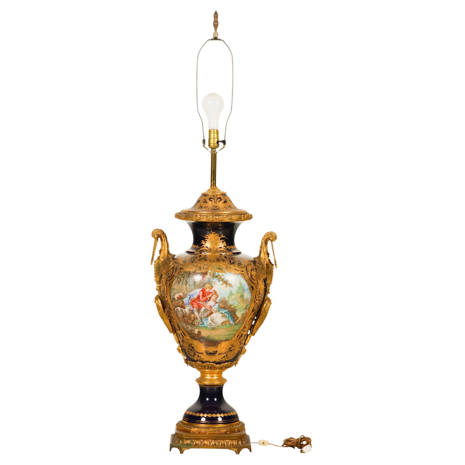 Antique Sevres Porcelain Ormolu Mounted Table Lamp: Antique French Sevres-style porcelain urn-form floor lamp mounted in gilt bronze. The cobalt blue porcelain body is decorated with hand-painted pastoral scenes within shaped reserves, depicting a cour