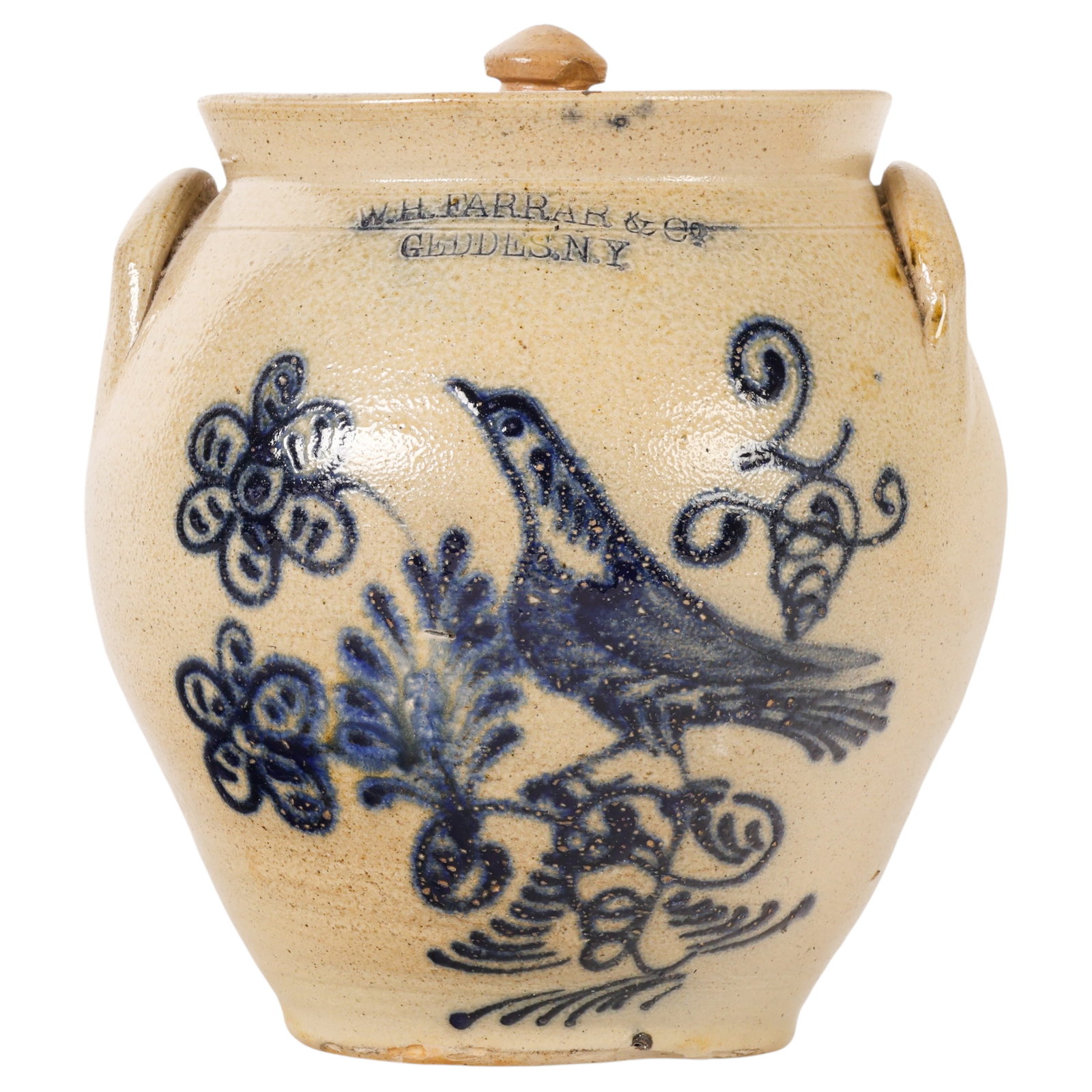 Antique W H Farrar & Co Geddes NY Stoneware Crock: Antique W.H. Farrar & Co. stoneware crock with cover, Geddes, New York, featuring an impressed maker's mark and hand-painted cobalt blue bird and floral decoration. The vessel displays an ovoid form w