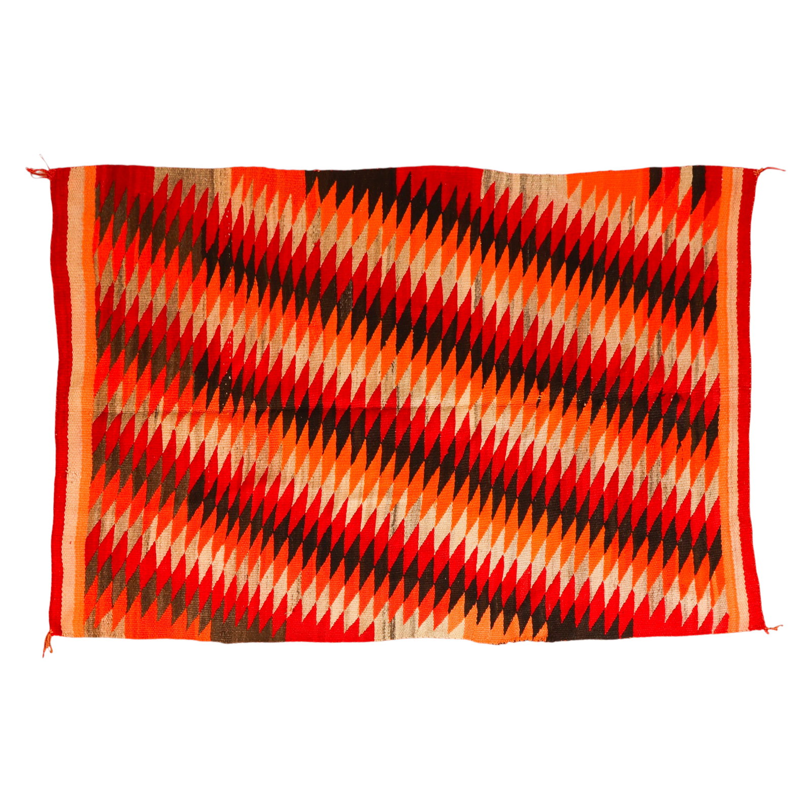 Navajo Southwestern Geometric Handwoven Wool Rug: Vintage Southwestern geometric handwoven wool rug featuring a repeating diamond and serrated motif in shades of rust red, orange, golden yellow, cream, gray, and black. The design reflects traditional
