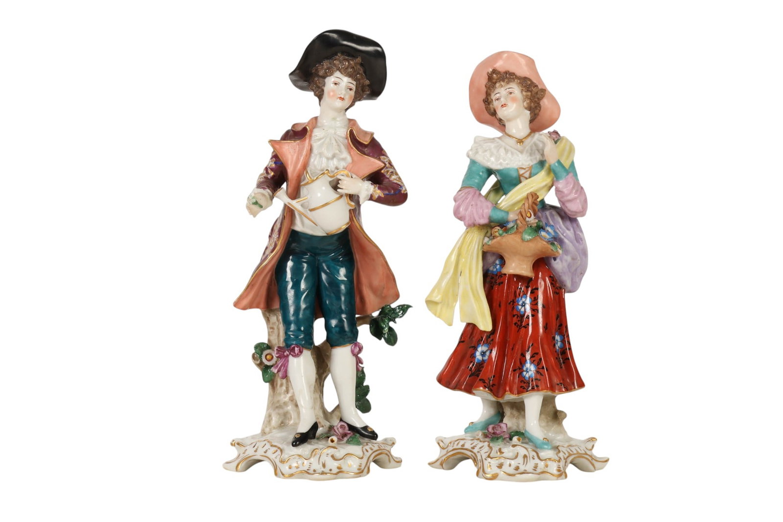 Antique Chelsea Porcelain 18thC Style Figurine LOT: Antique pair of English hand painted porcelain figurines depicting a gentleman and lady in 18th century dress. The woman holds a basket of flowers, while the man holds a vessel. Each is decorated with