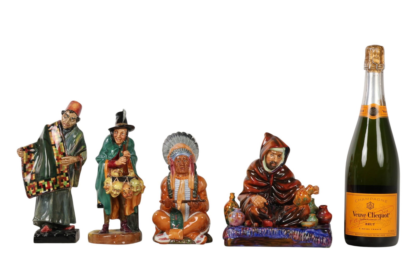 Royal Doulton The Potter Carpet Seller Mask Seller: Royal Doulton England lot of four porcelain figurines. Includes The Carpet Seller HN1464 (1929-1969). Designed by Leslie Arthur Harradine. The Chief HN2892. Designed by William K. Harper. (1979-1988).