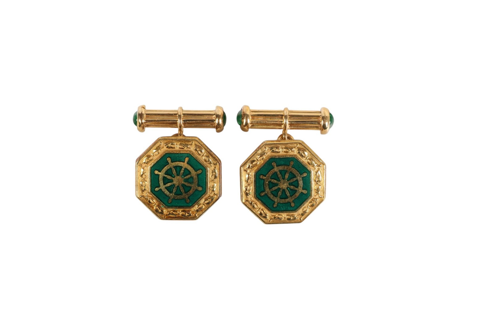 14k Gold Enamel and Emerald Nautical Cufflinks 12g: Pair of 14K gold enamel and emerald cufflinks. Featuring an octagonal design with green enamel centers accented by a nautical ship wheel motif, with cabochon emerald terminals measuring approximately 