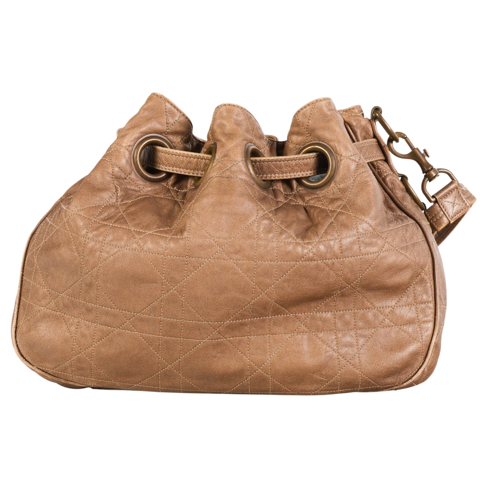 Vintage Dior Cannage Leather Drawstring Bucket Bag: Christian Dior vintage bucket bag crafted in metallic bronze gold quilted leather featuring the house's iconic Cannage pattern. The relaxed drawstring silhouette is accented by antiqued brass tone har