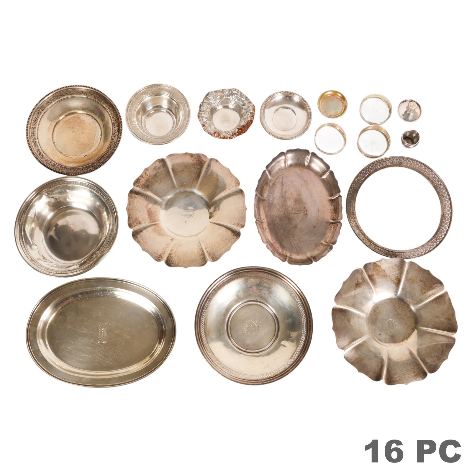 Sterling Silver Trays Dishes Bowl and MORE 3,280g.: Sterling silver 16 piece estate lot of assorted trays, bowls, coasters, and table accessories. The lot includes a pair of floral form bowls, a heavily dented bowl, a round tray with reticulated rim an