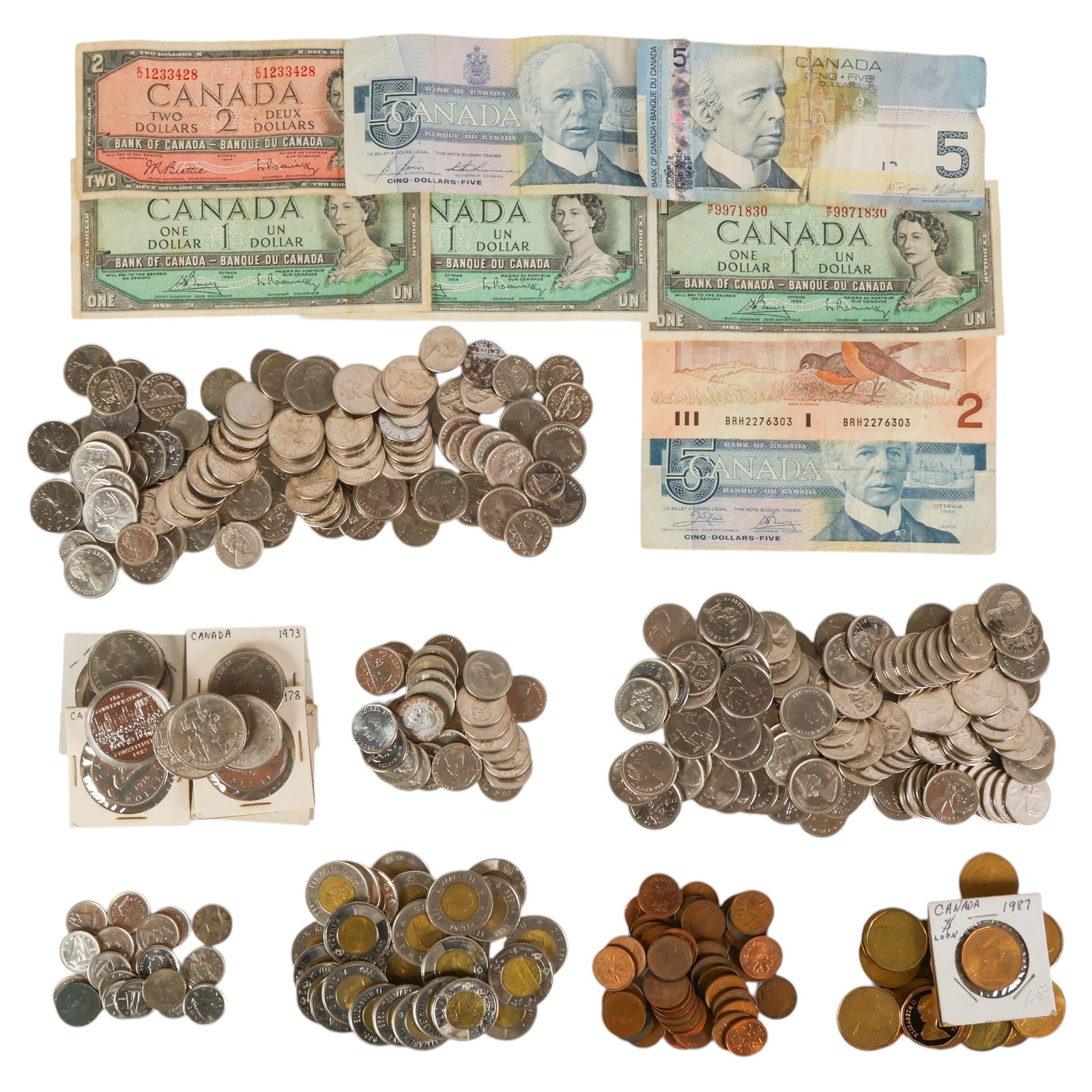 Canadian Coin and Currency LOT $203.21 Face Value: Estate lot of Canadian currency from various years comprising 41 one-cent coins, 75 five-cent coins, 38 ten-cent coins, 153 twenty-five-cent coins, 25 one-dollar coins (loonies), 27 two-dollar coins (