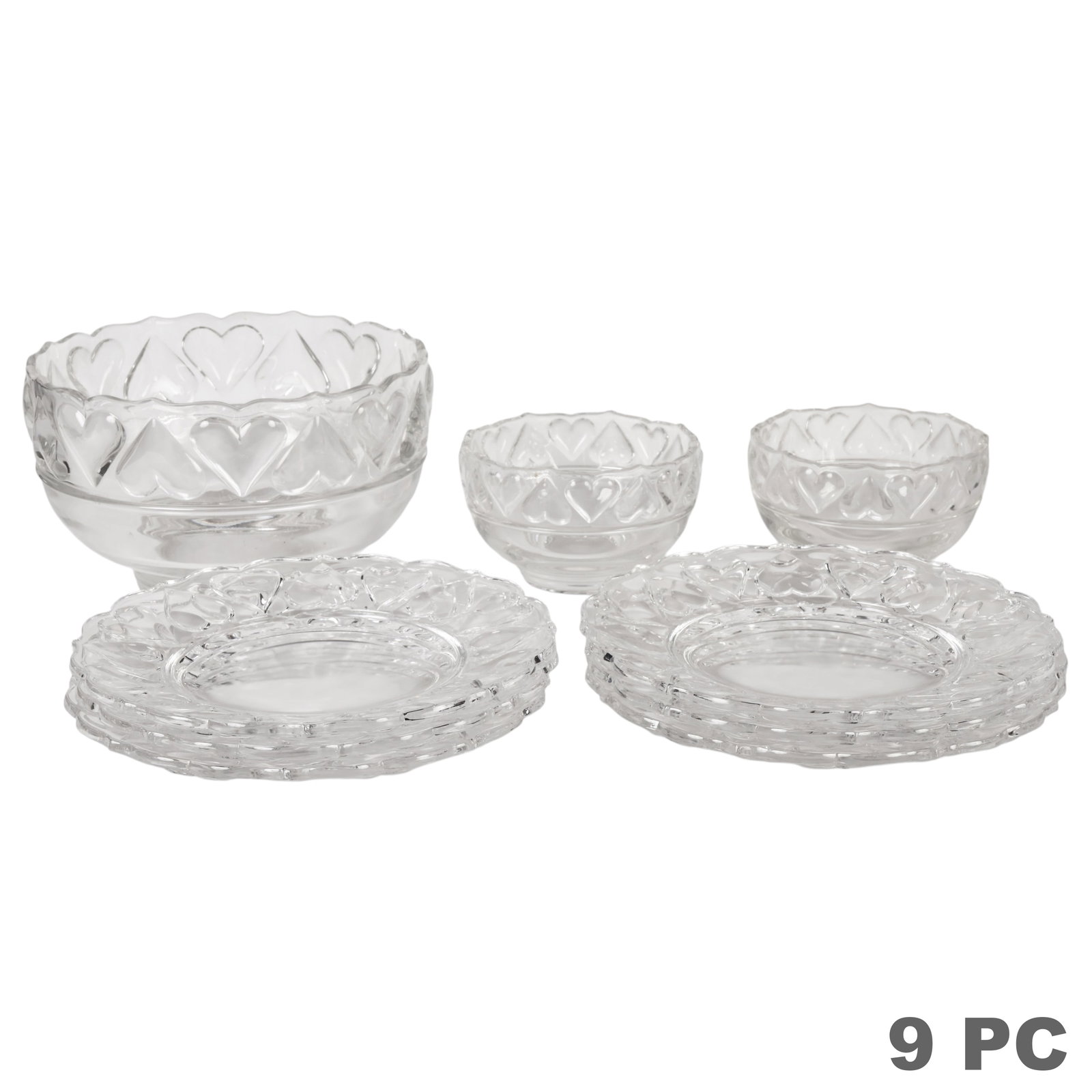 Tiffany & Co Glass Hearts Plates & Bowls 9pc LOT: Nine-piece Tiffany & Co. clear glass serveware group in the Hearts pattern, each featuring a repeating open heart motif around the rim. Comprising six plates, one pedestal serving bowl, and two smalle