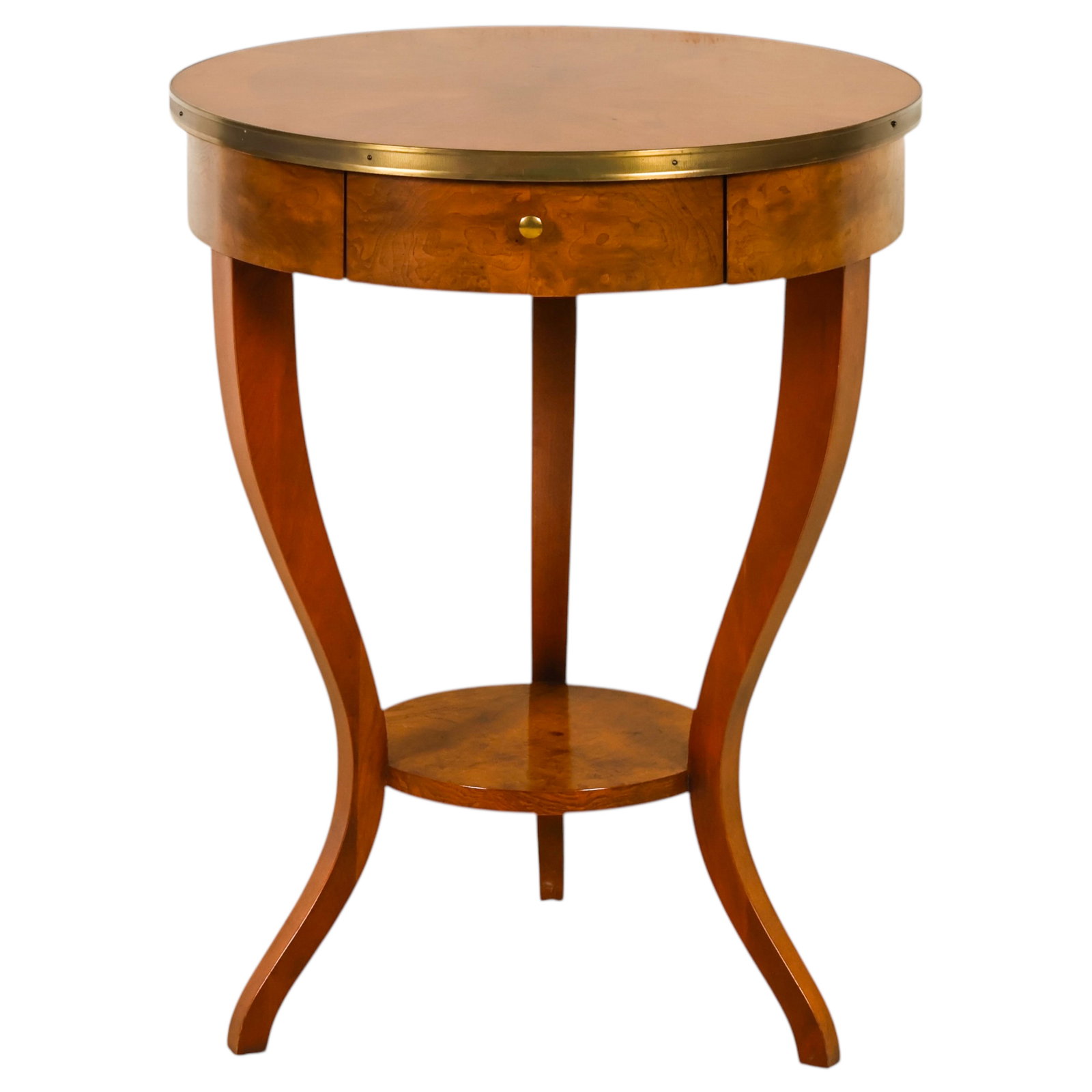 Baker Furniture Round Wood One Drawer Accent Table: Baker Furniture classic Regency style round side table featuring a burl veneer top and apron with a brass gallery edge. The table is fitted with a single frieze drawer retaining its Baker Furniture pl