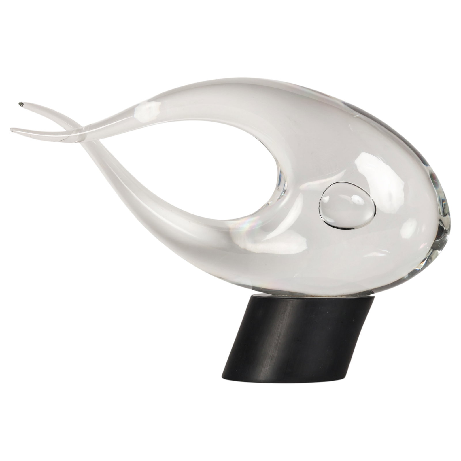 Elio Raffaelli b.1936 Murano Glass Fish Sculpture: Elio Raffaelli (Italian, born 1936), clear blown glass fish sculpture executed in a stylized form with an elongated flowing body, open center, and sweeping tail. Incorporating a controlled air bubble 