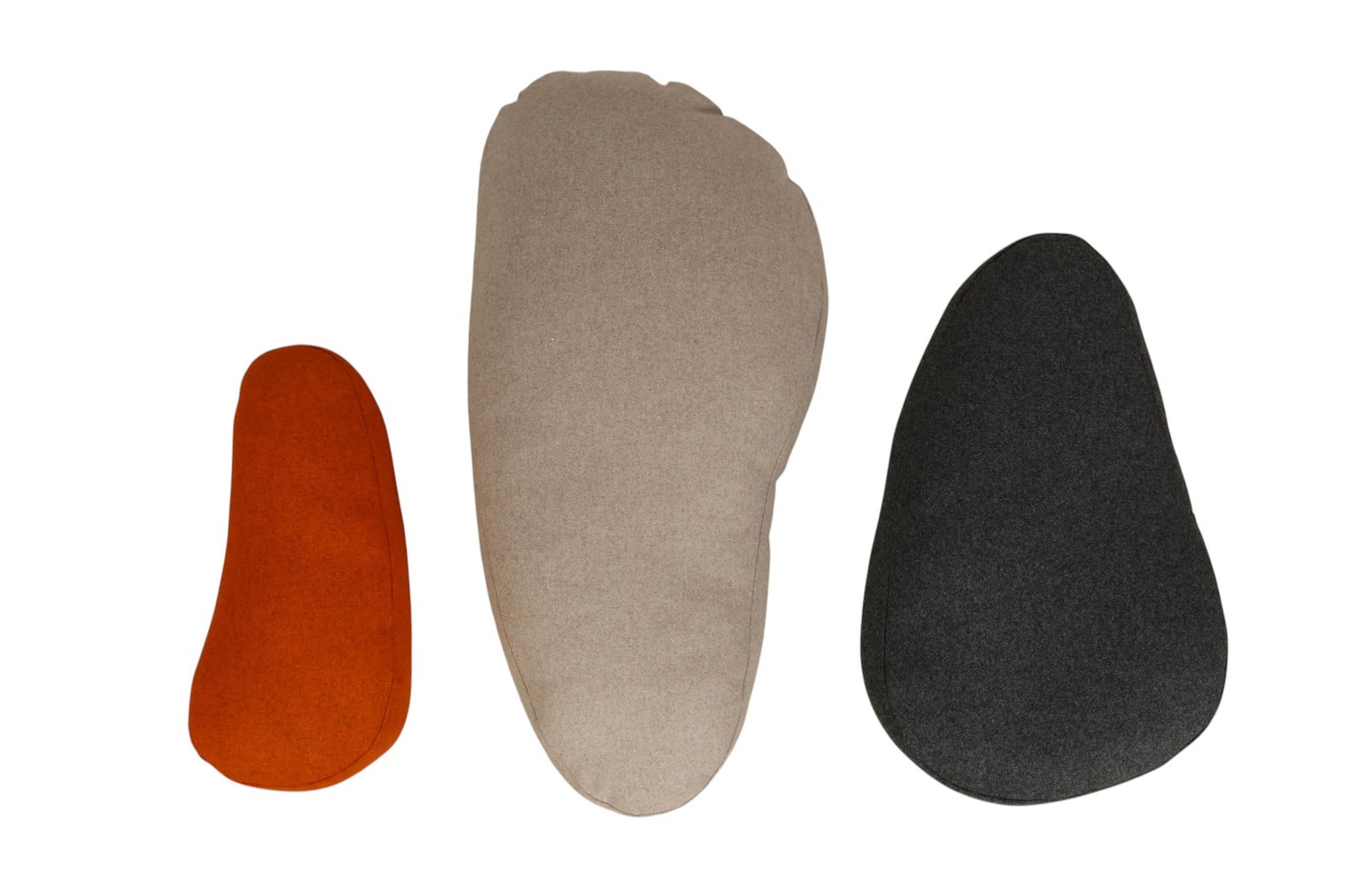 Designer Wool Throwing Stone Sculptural Pillow LOT: Contemporary three-piece set of Iglooplay Throwing Stones upholstered cushions, inspired by naturally smoothed river stones. Sculptural yet functional, these rounded floor cushions are designed for ve