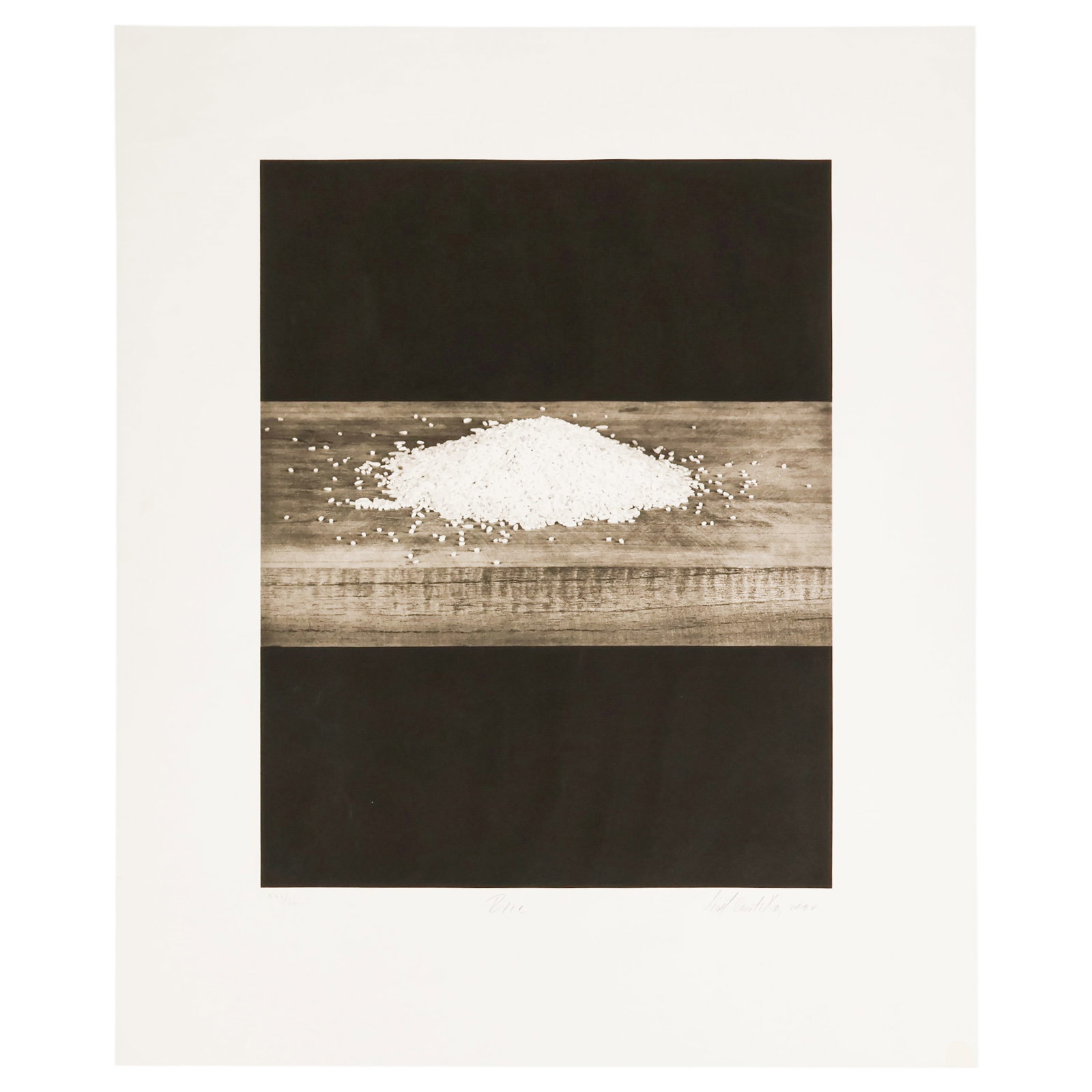Liset Castillo b.1974 Rice LE Photogravure SIGNED: Liset Castillo (Cuban, born 1974), Rice, 2000. Large format black and white photogravure on Somerset Textured White paper depicting a mound of rice resting upon a wooden plank against a stark black gr