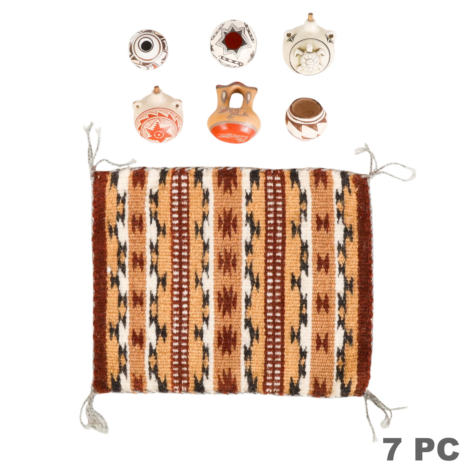 Miniature Southwestern Pottery Vessels and Rug LOT: Southwestern collection of six miniature pottery vessels together with a miniature handwoven rug. Lot includes three miniature olla form vessels decorated with stylized animal and geometric motifs, a 