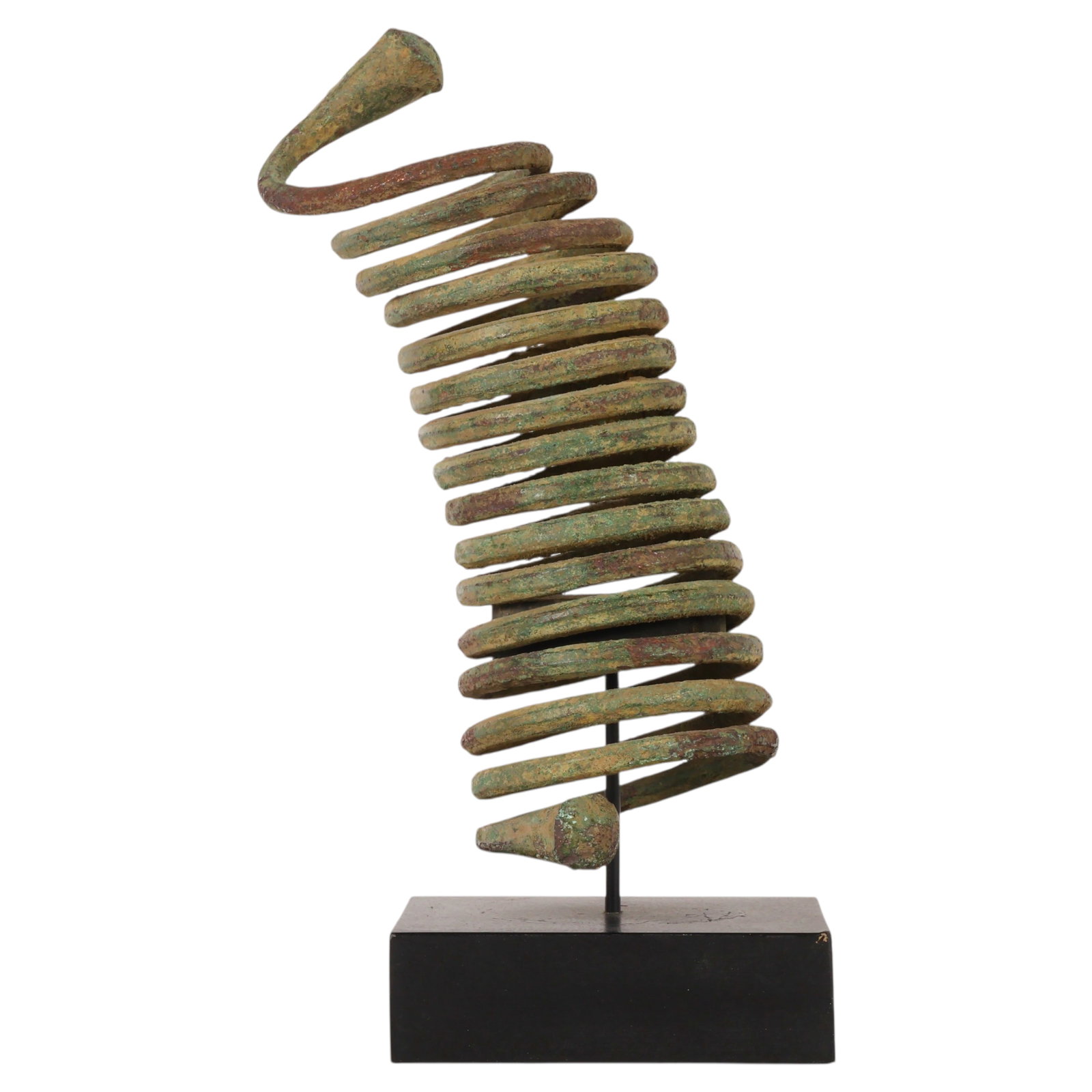 African Tribal Copper Coil Anklet on Display Stand: African tribal copper coil anklet or leg ornament formed as a multi-coil spiral with flared terminals. The ethnographic adornment displays verdigris and patina consistent with age and use and is mount