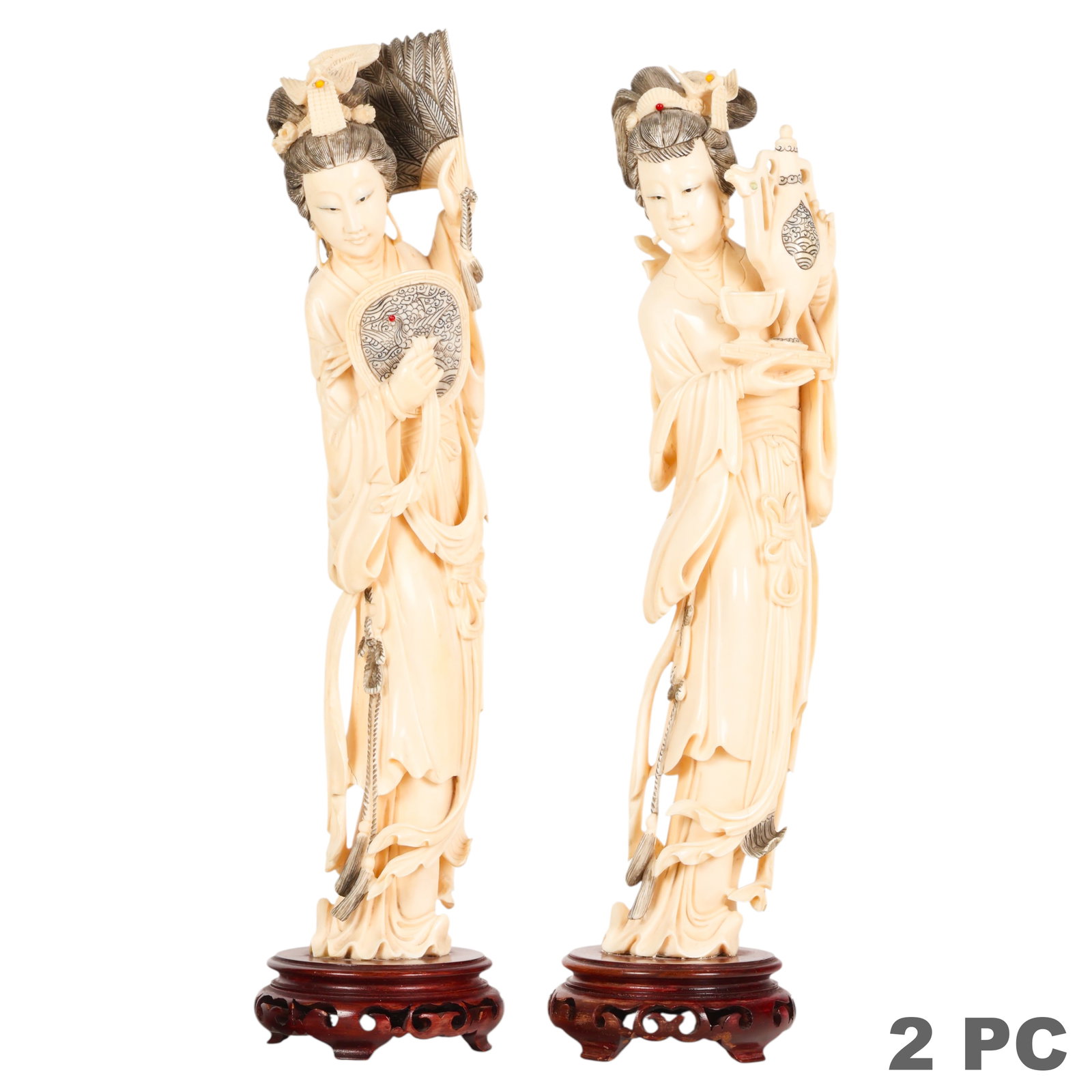 Chinese Carved Guanyin Bodhisattva Sculptures LOT: Two antique carved Chinese Kwan Yin style female figures, each depicted in flowing robes and elaborate coiffures, holding symbolic objects including a ceremonial vessel. Executed in carved organic mat