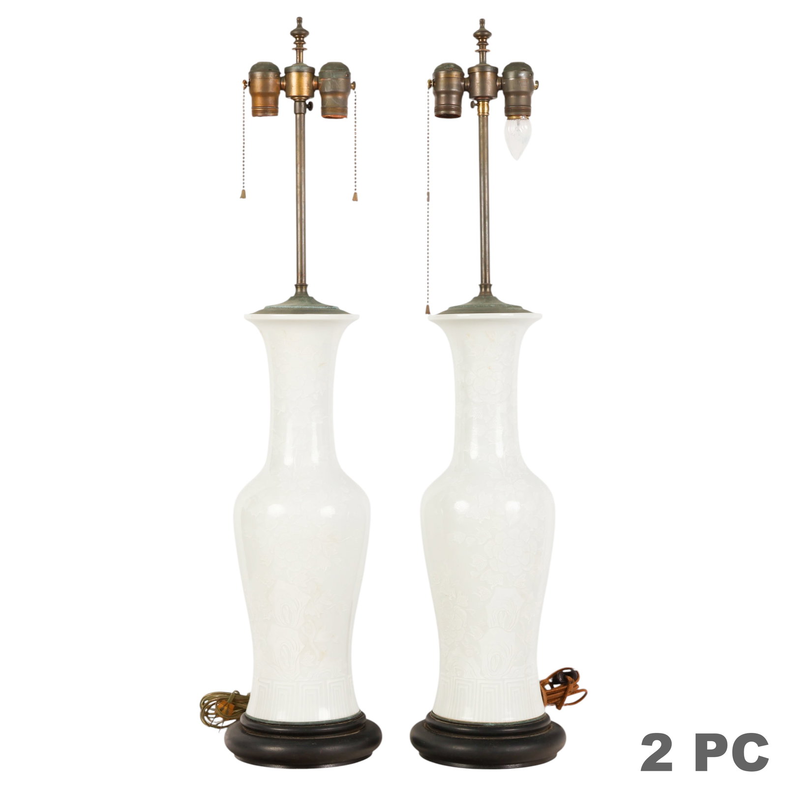 Japanese Bianco Sopra Porcelain Table Lamps PAIR: Pair of vintage Japanese Bianco Sopra style porcelain table lamps, each featuring a baluster form white porcelain body with molded floral relief decoration and geometric border motifs, mounted on blac
