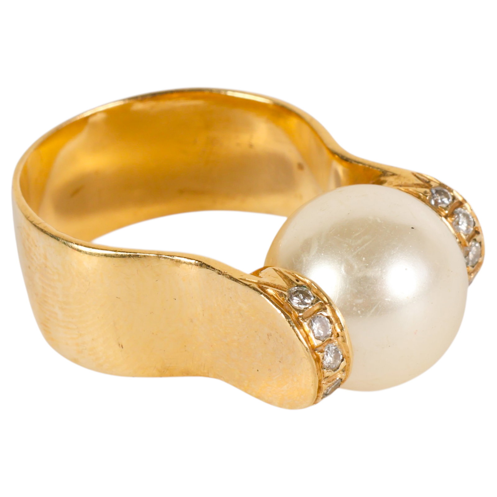 14k Yellow Gold Pearl and Diamond Size 7 Ring 8g.: 14K gold ring set with a 10 mm center pearl accented by five small diamonds on each side. Modern design. Interior stamped "14K." No apparent maker's marks. Total weight approximately 8 grams. Ring siz