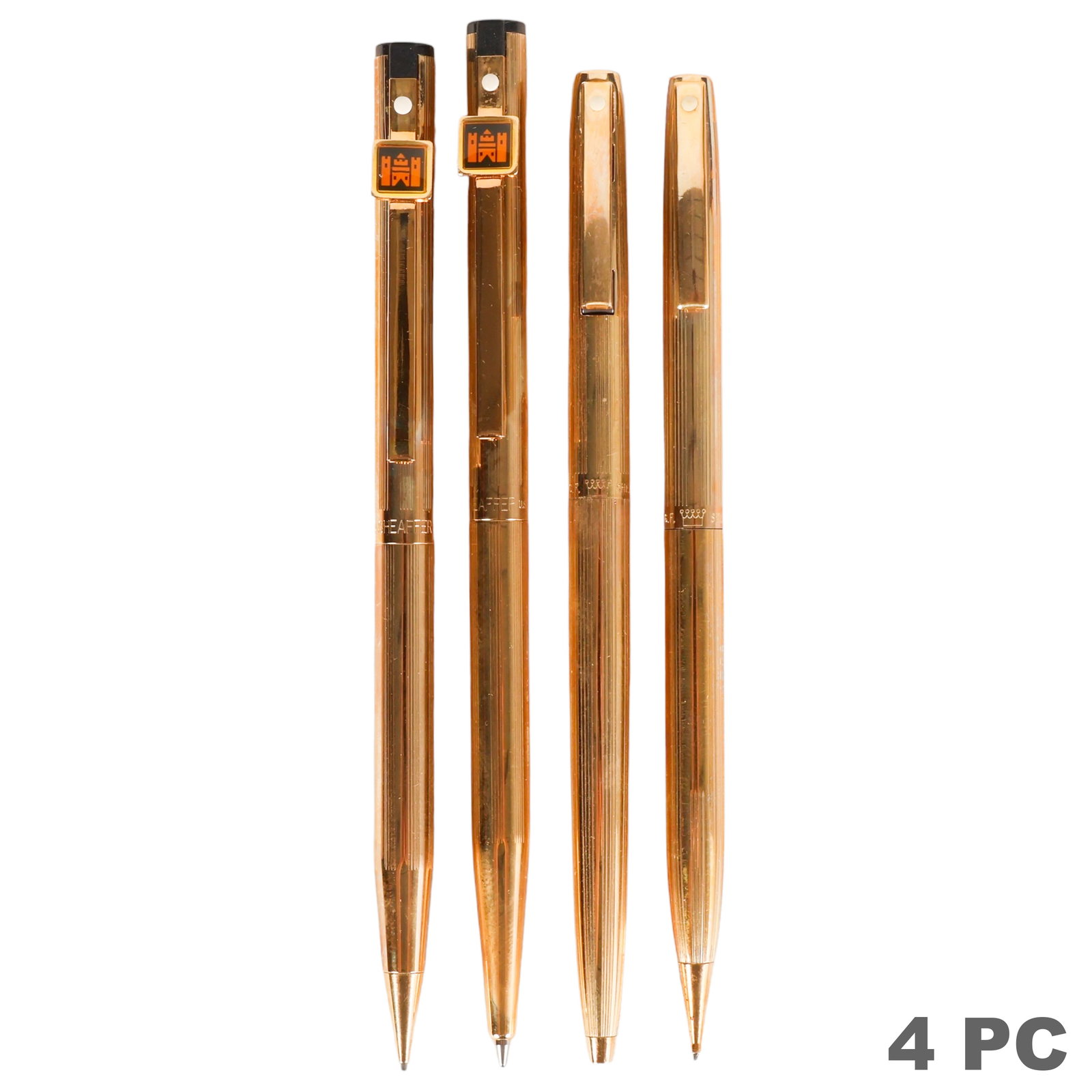 Sheaffer Gold Filled & Plated Pen & Pencil SETS: Sheaffer U.S.A. lot of two desk writing instrument sets, each comprising one ballpoint pen and one mechanical pencil housed in a presentation case. One set features a gold-filled finish with black fin
