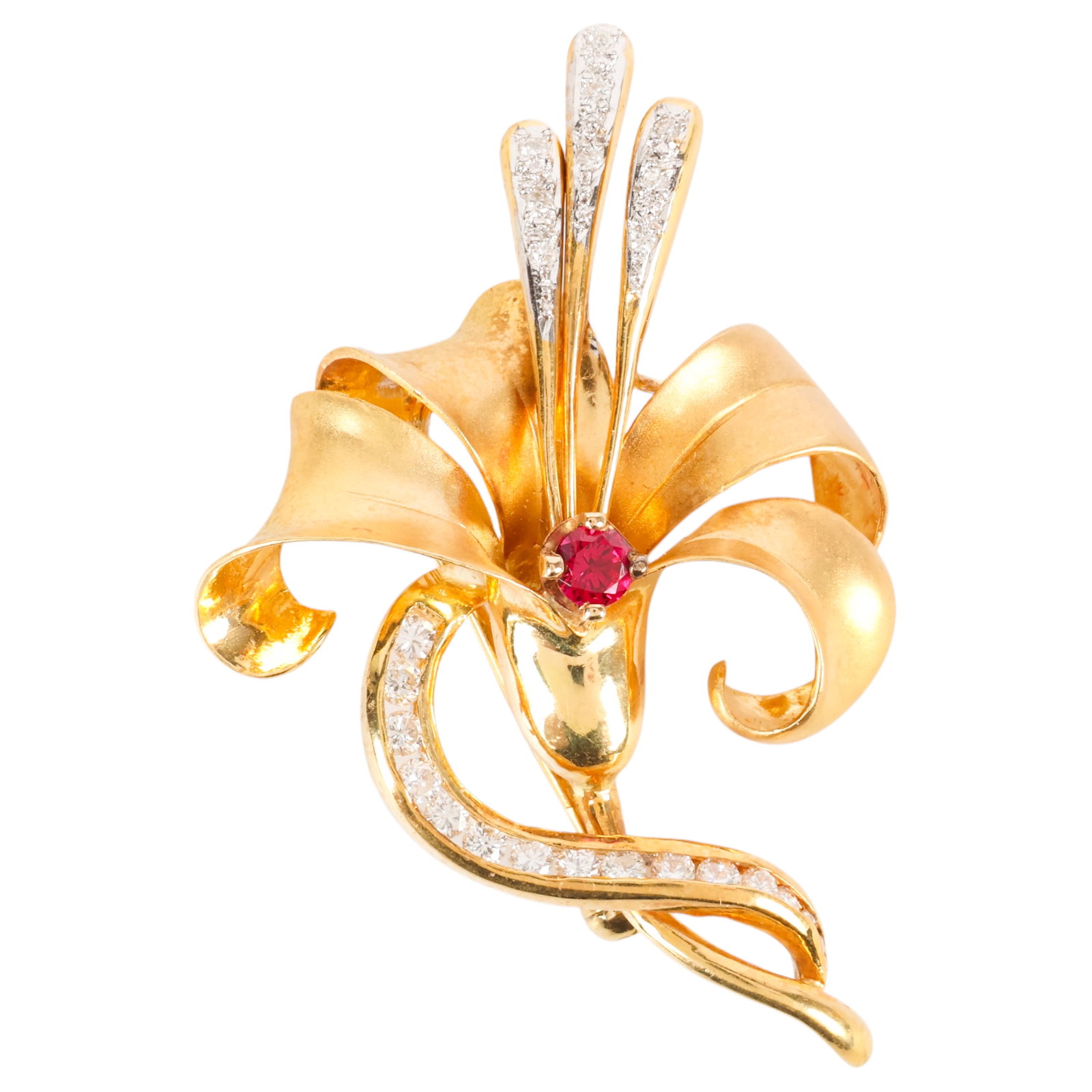 18k Yellow Gold & Diamond Gemstone Floral Pin 9.6g: Retro 18K yellow gold floral brooch featuring sculptural ribbon-form petals centered by a red gemstone measuring approximately 3 mm. The scrolling stem is accented with sixteen round brilliant-cut dia