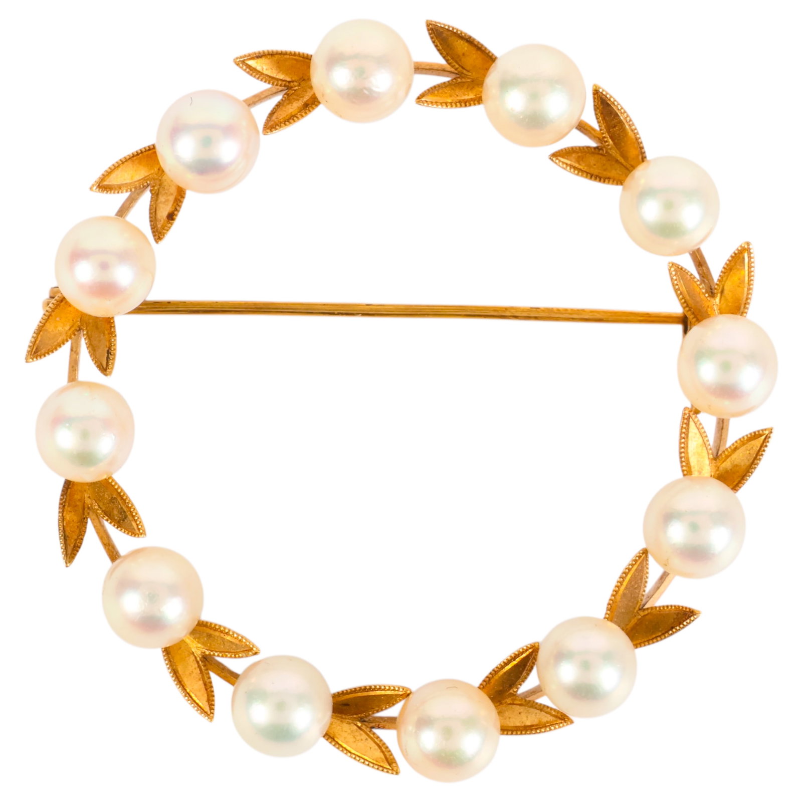 Gold Saltwater Cultured Akoya Pearl Wreath Brooch: 14K yellow gold wreath brooch set with eleven saltwater cultured Akoya pearls measuring approximately 4.7 mm each, arranged among textured leaf motifs in a circular wreath design. Stamped 14K. Measure