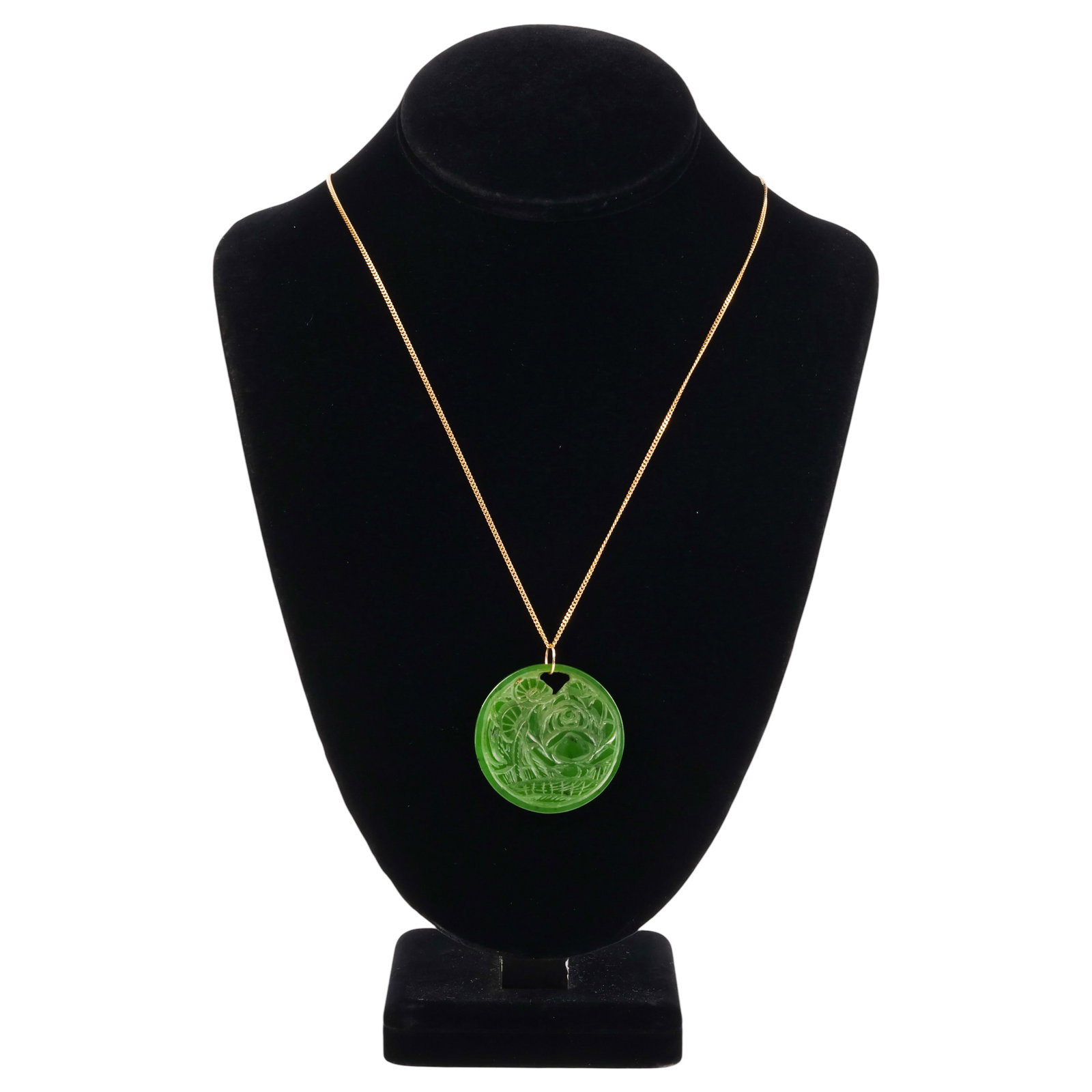 18k Gold Chain with Carved Green Jade Disc Pendant: Vintage 18K yellow gold chain with a round spinach jade disc pendant featuring an etched foliate design. The necklace measures 24 inches in length and is stamped "750" on the clasp. The circular carve