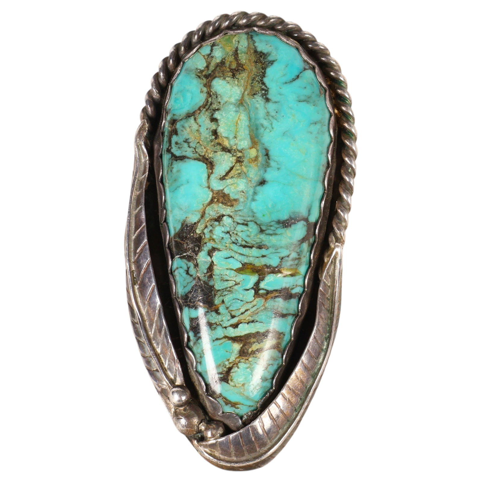 Vintage David Kayo Sterling Silver Turquouse Ring: David Kayo vintage Native American sterling silver ring set with a large freeform turquoise cabochon. The setting features hand-applied rope-twist and feather motif decoration. Marked "KAYO 79" verso.