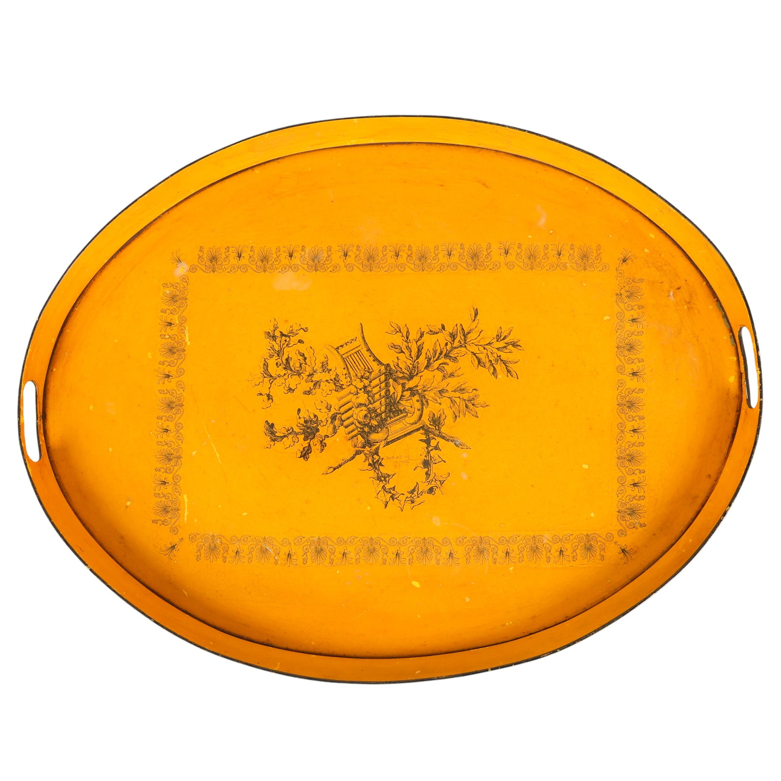 Italy Tole Hollywood Regency Style Large Tole Tray: Large Italian Hollywood Regency style tole tray executed in a mustard color with a central musical instrument scene. Fitted with double handles and finished with black trim around the edge and a solid