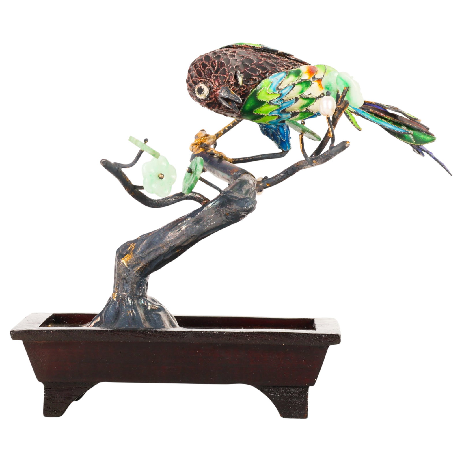 Chinese Silver Jade Enamel Cloisonne Bird Figurine: Chinese silver figural sculpture depicting a perched bird with cloisonne enamel wings and tail, textured silver body, carved jade leaves, and a cultured pearl blossom mounted on a naturalistic silver 