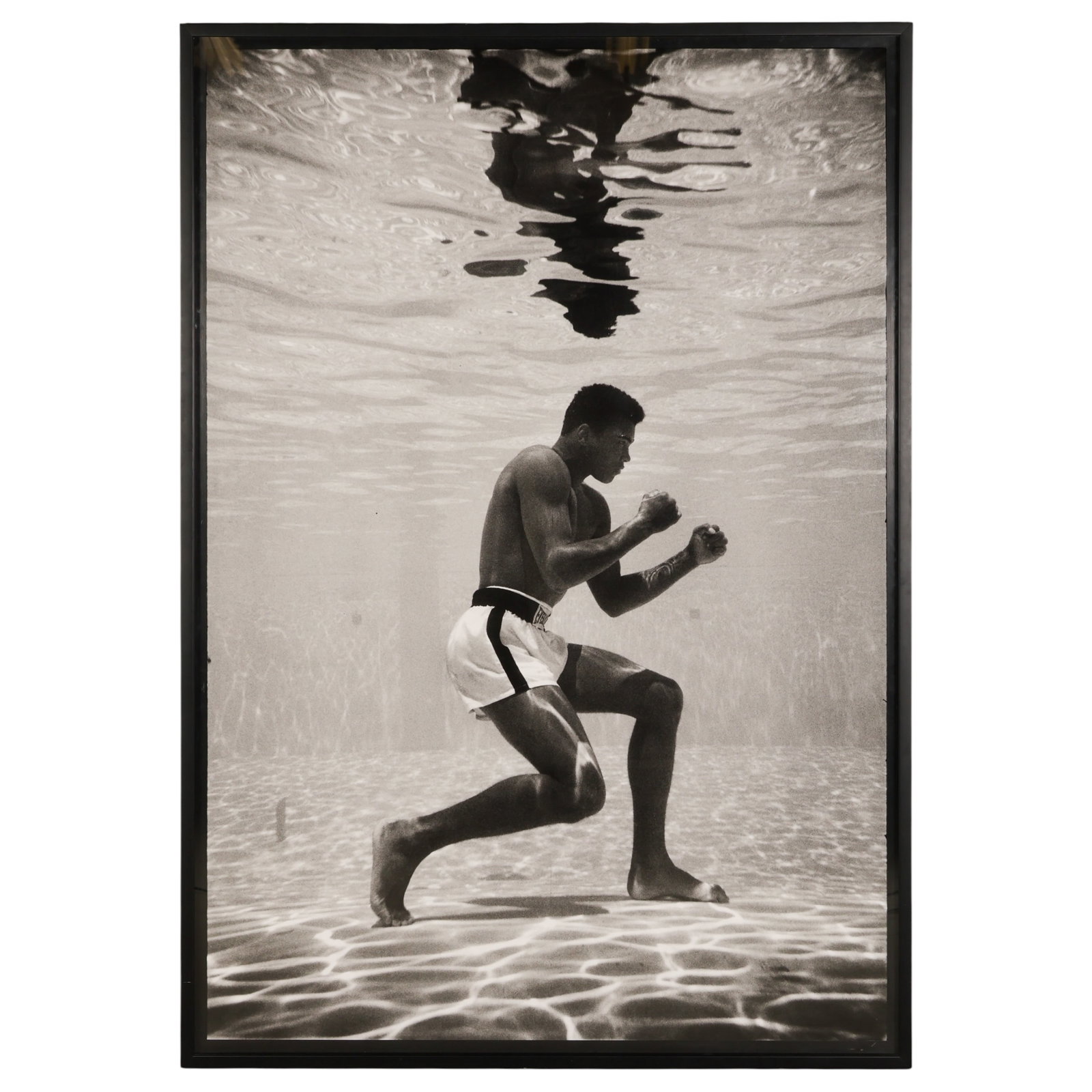 Flip Schulke 1930-2008 Ali Underwater Photograph: Flip Schulke (American, 1930-2008), Ali Underwater, 1961, silver gelatin photograph depicting Muhammad Ali in a boxing stance beneath the surface of a swimming pool, one of the most recognizable image