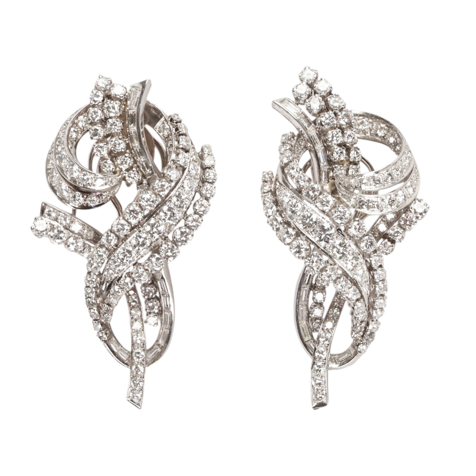 Platinum 10.5 CTTW Diamond Spray Pair Earrings 39g: Pair of platinum and diamond spray earrings designed as asymmetrical cascading arrangements of sweeping ribbons, floral clusters, and foliate forms, set throughout with approximately 180 round brillia
