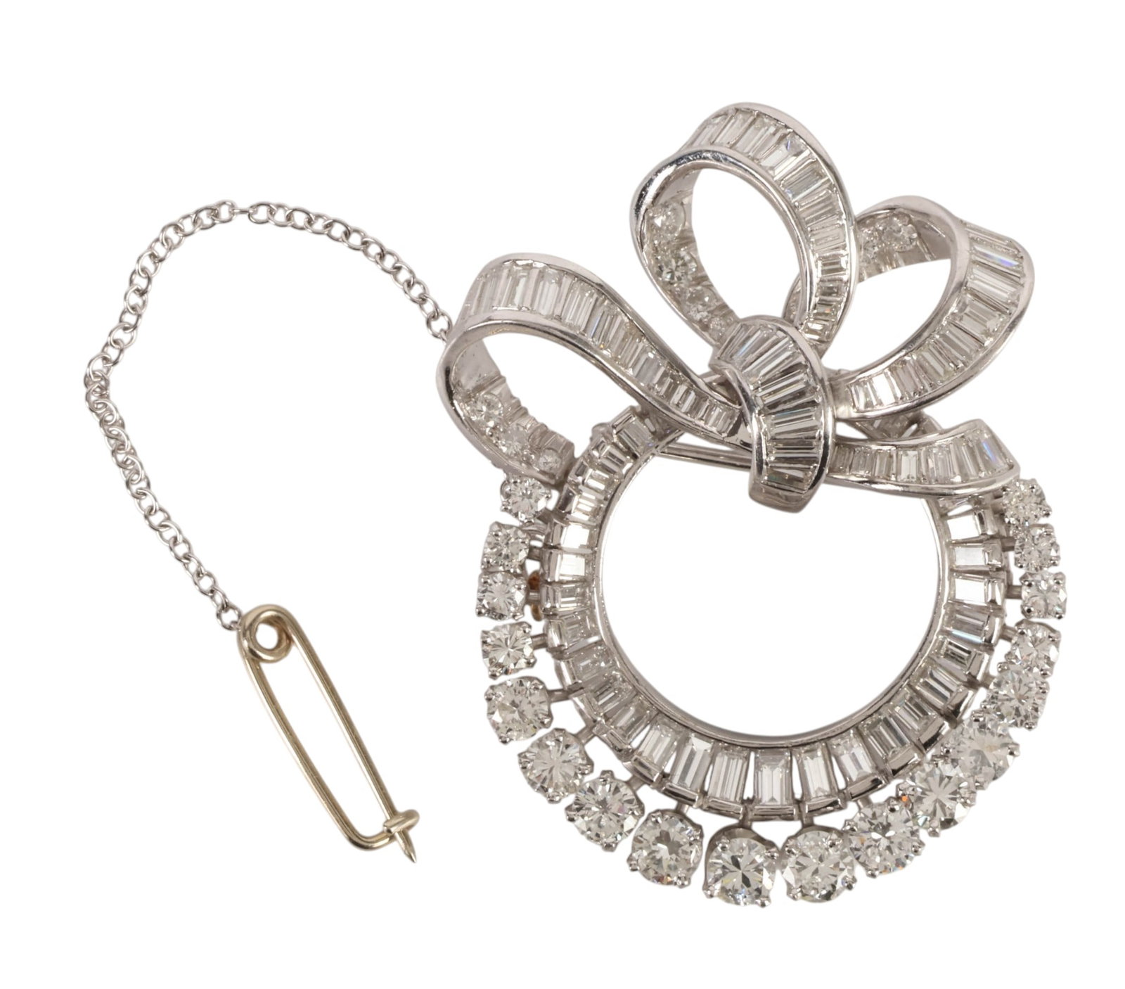 Platinum 8.50 CTTW Diamond Art Deco Ribbon Brooch: Art Deco platinum diamond brooch designed in a stylized bow and circular wreath form, set throughout with round brilliant-cut and baguette-cut diamonds totaling approximately 8.50 CTTW. The circular s