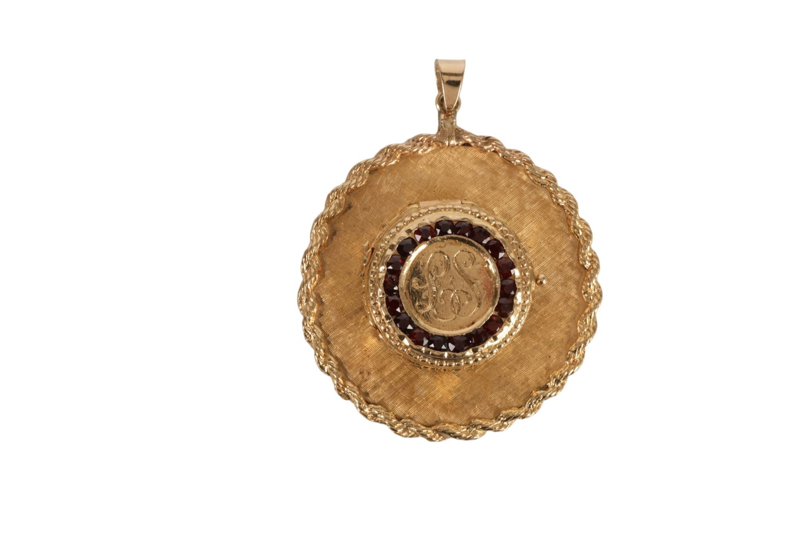 14K Gold and Garnet Wide Brim Hat Locket 20 Grams: 14K gold wide brim hat locket with rope gold edging and a garnet set border surrounding a monogrammed crown. The crown opens to reveal a small compartment. The reverse is monogrammed with a "Happy Ann