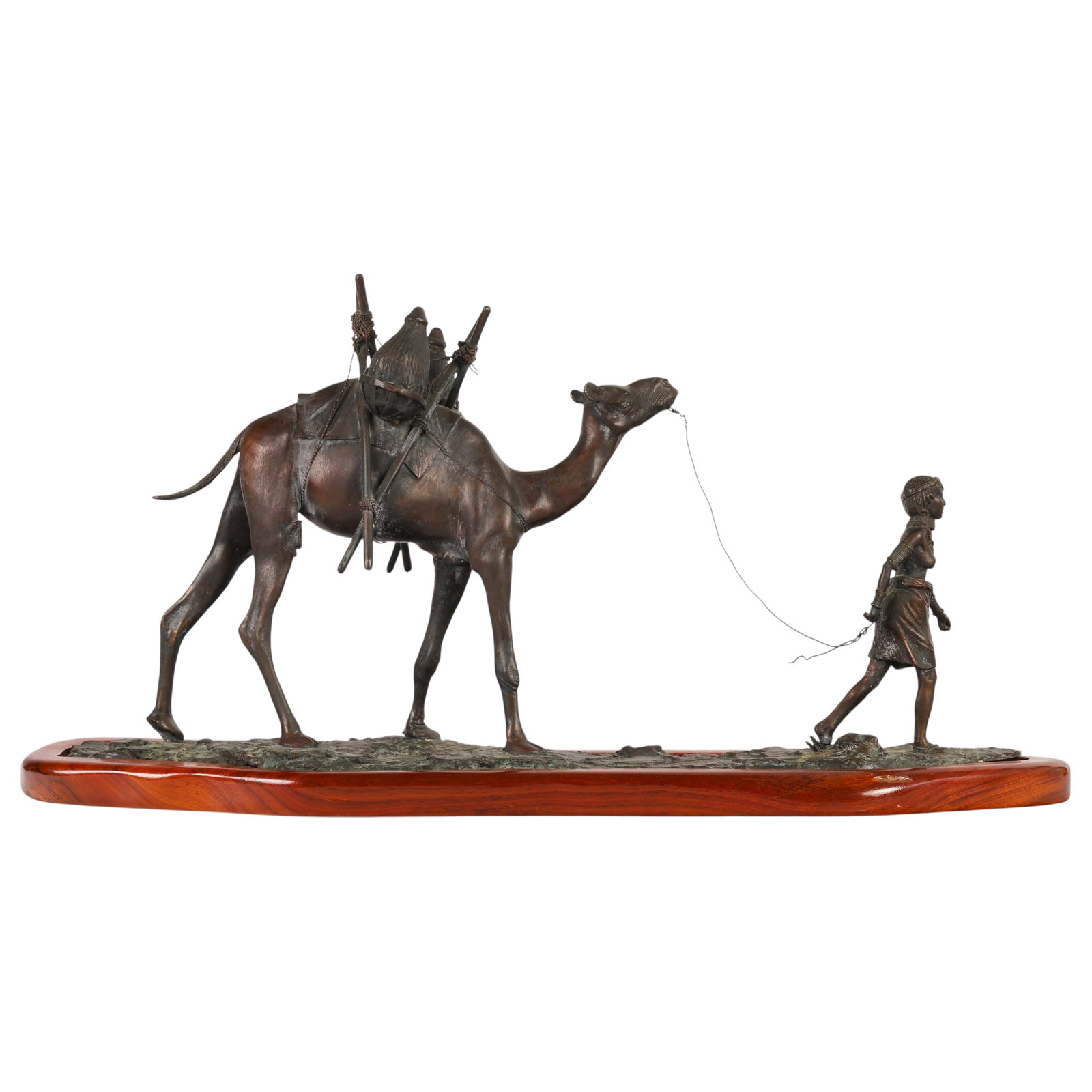 Robert Glen 1940-2023 Boy & Camel Bronze Sculpture: Robert Glen (South African, 1940-2023), bronze sculpture depicting a camel caravan scene with a robed boy figure leading a fully saddled camel across a textured terrain base. The elongated composition