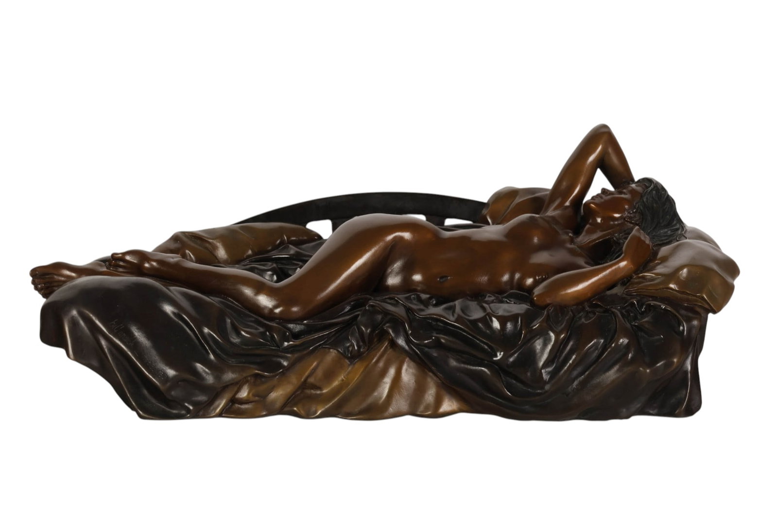 Bill Mack b.1944 Tranquility Bronze Nude Sculpture: Bill Mack (American, born 1944), Tranquility, limited-edition bronze sculpture depicting a reclining female nude resting on a draped bed with pillows, rendered in warm bronze and dark patinated finish