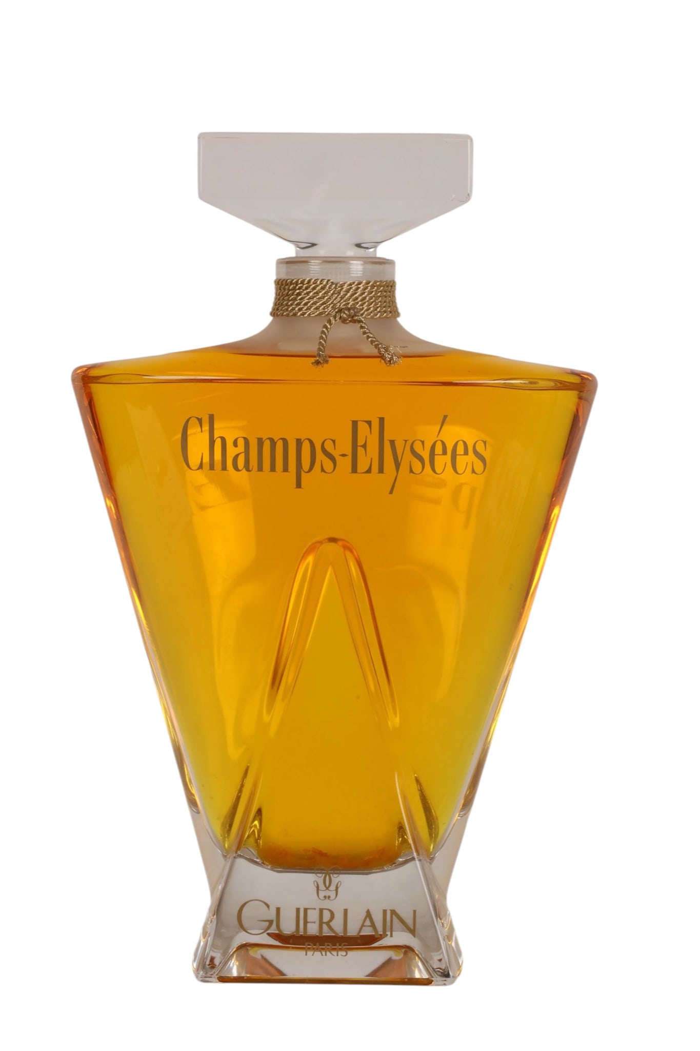 Champs Elysees Guerlain Factice Perfume Bottle: Guerlain Paris vintage Champs-Elysees display factice perfume bottle of sculptural clear glass form, filled with amber-colored display liquid and fitted with an oversized clear glass stopper. Front ma