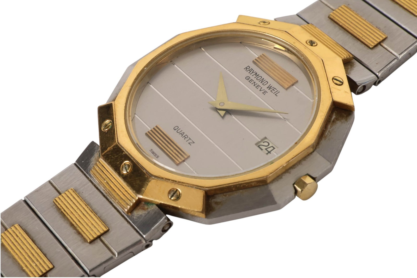 Raymond Weil Vintage Geneve Two Tone Quartz Watch: Raymond Weil Geneve vintage two-tone quartz wristwatch featuring a stainless steel case and integrated bracelet with 18K yellow gold electroplated accents, silver-tone horizontally striped dial, minim